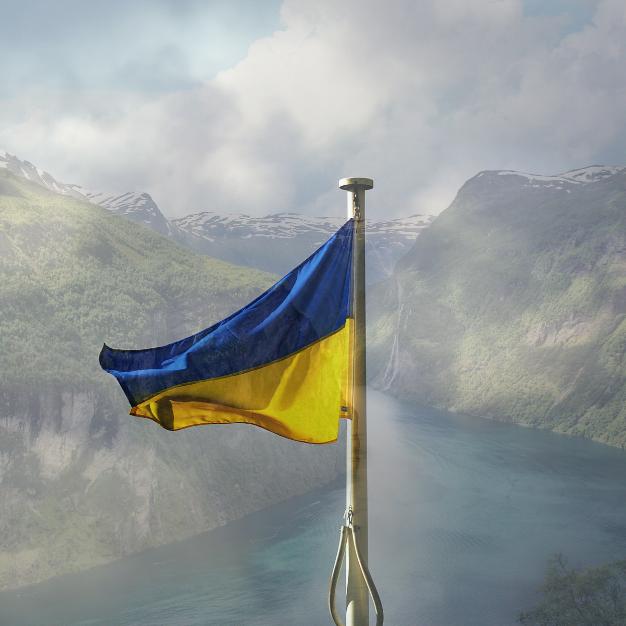 Ukraine flag with Norwegian Fjord behind