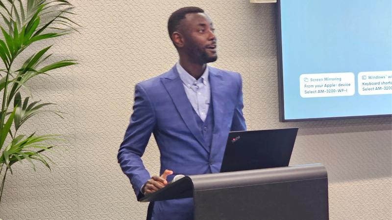 Akinwale speaking at a conference