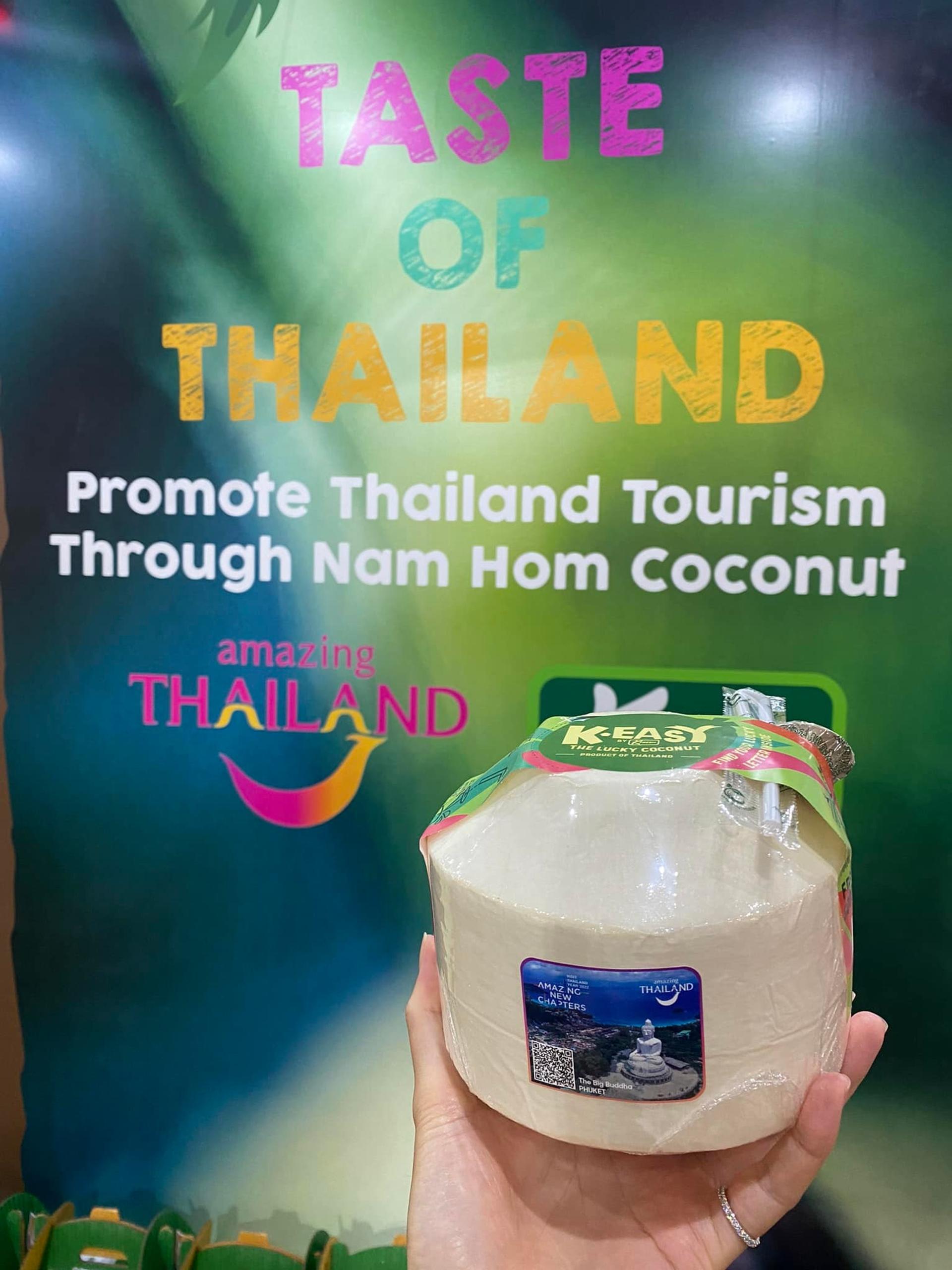  Hand holding coconut water from K Fresh
