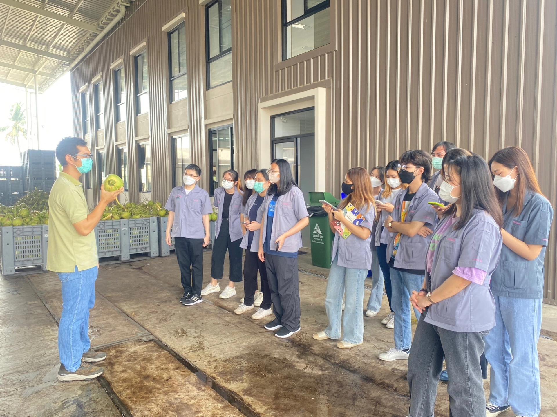 Students listening to a lecture in the factory