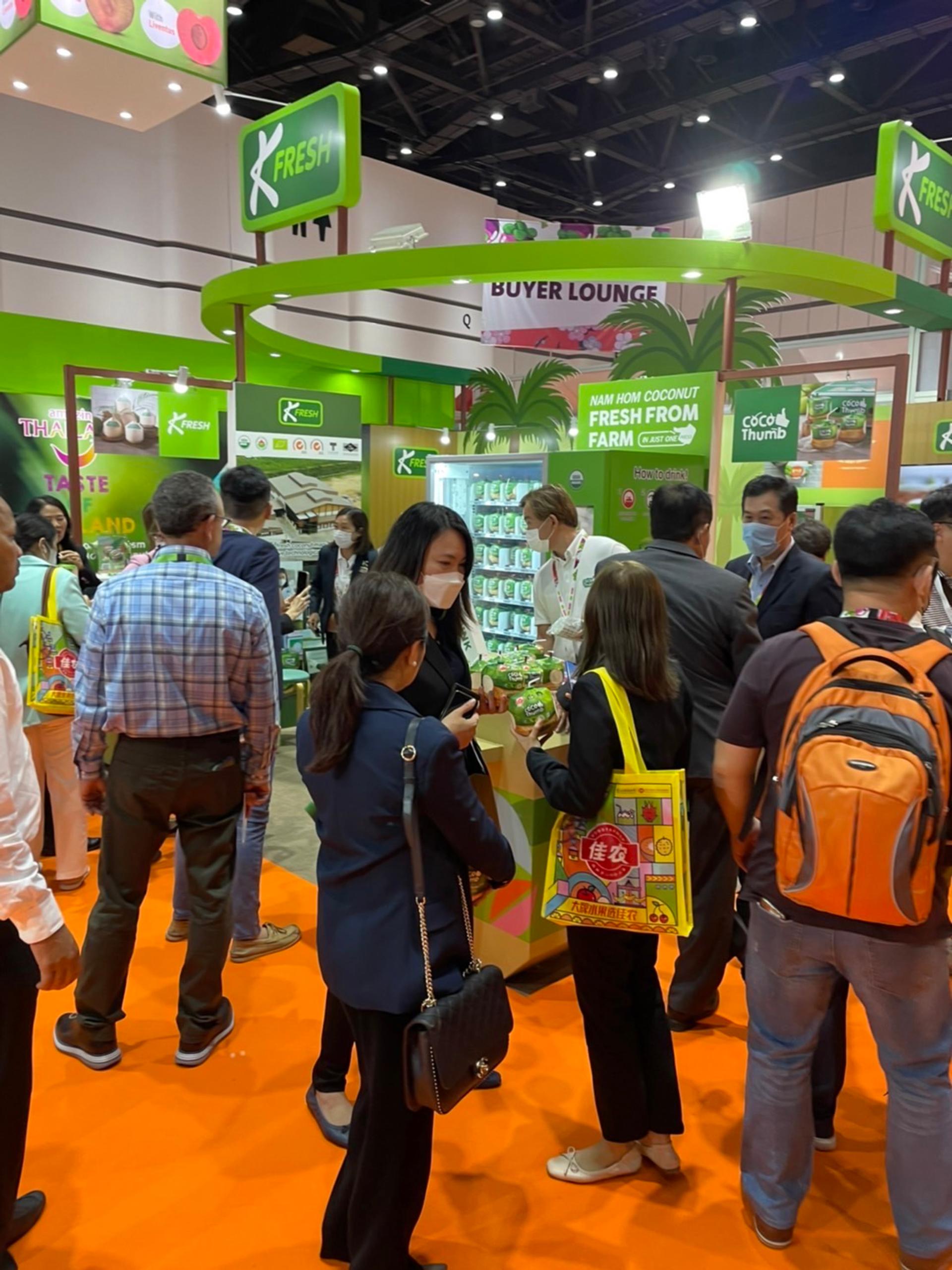 People in front of the K-Fresh booth