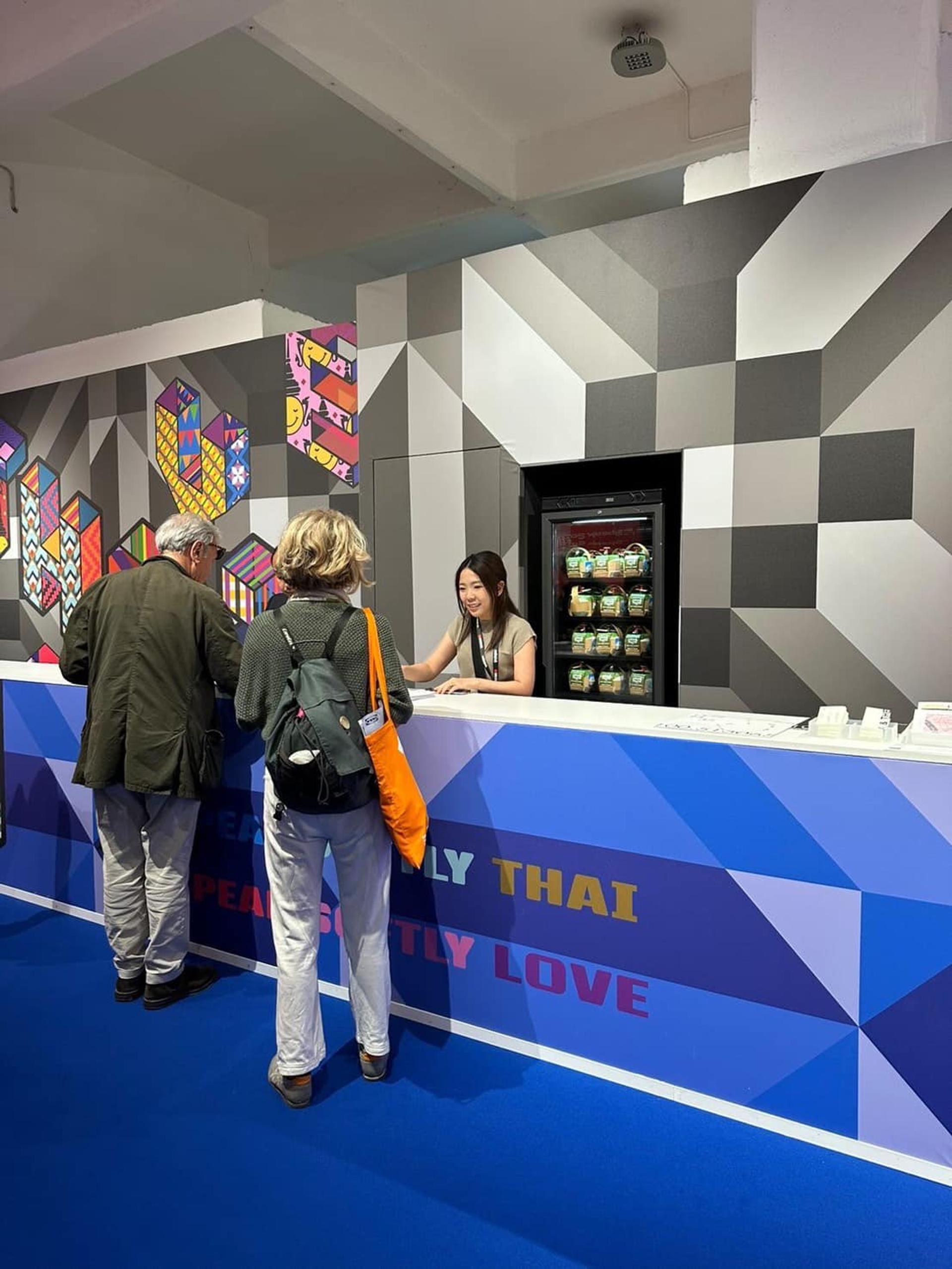People stand and admire coconut water from K-Fresh.