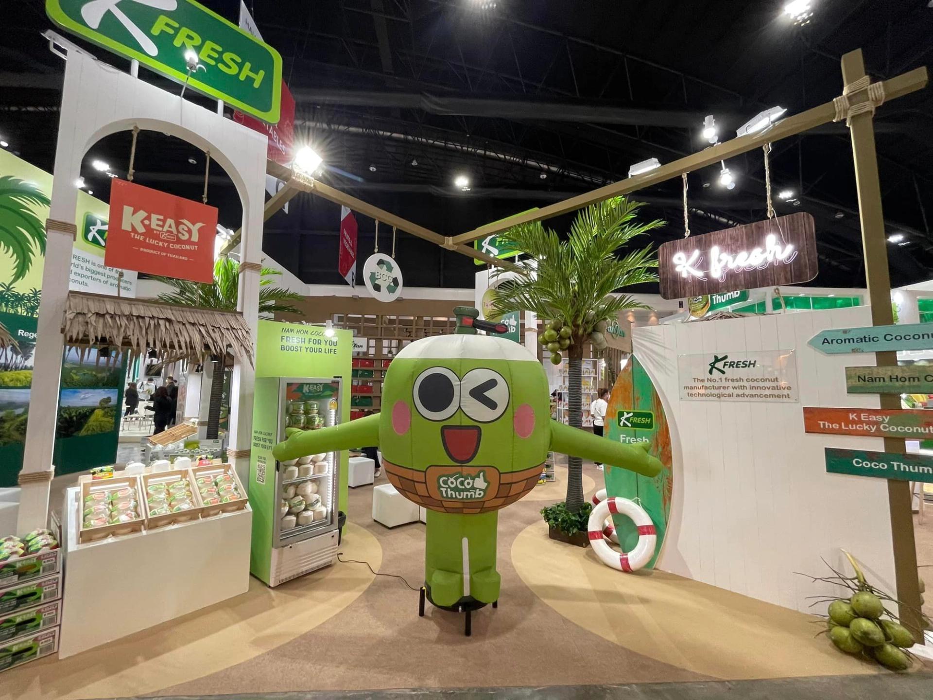K-Fresh's green coconut cartoon mascot