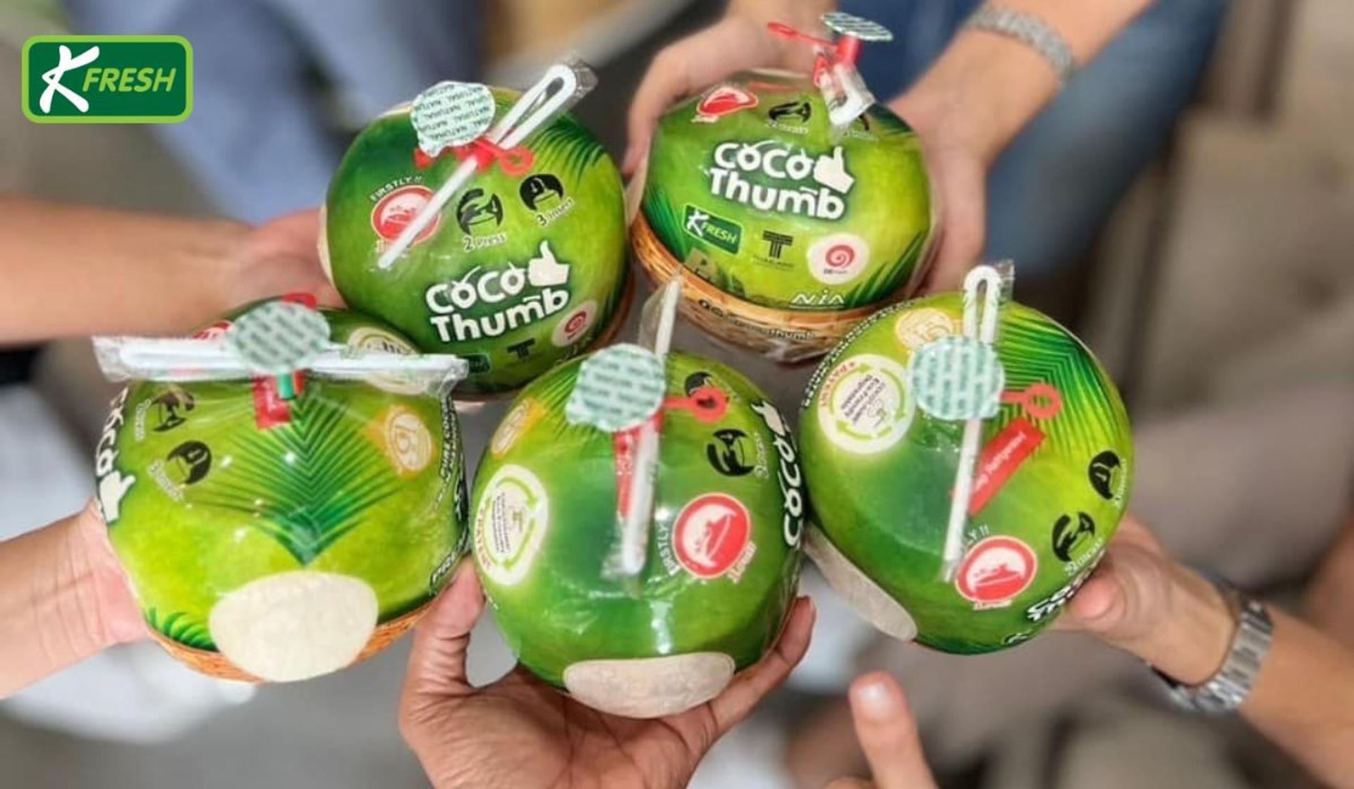 Coconut water in a coconut shell with a straw