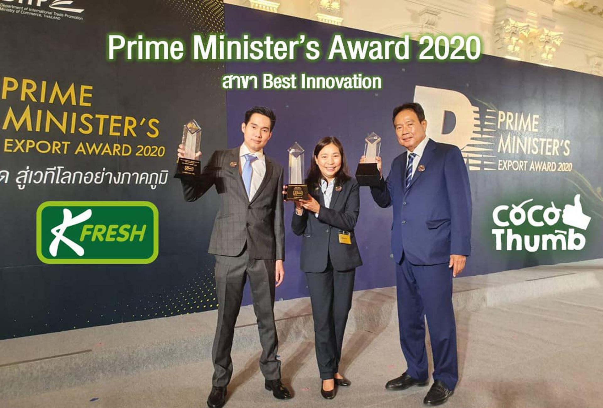 Three K fresh executives hold trophies.