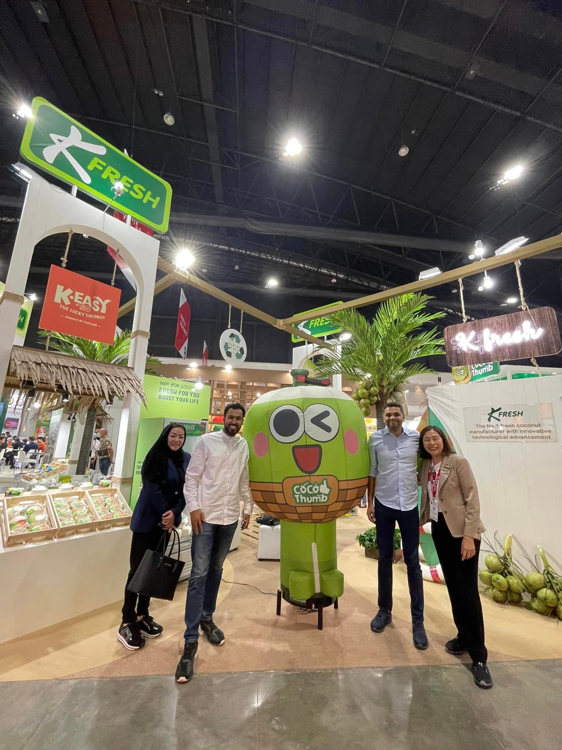 People taking photos with the mascot