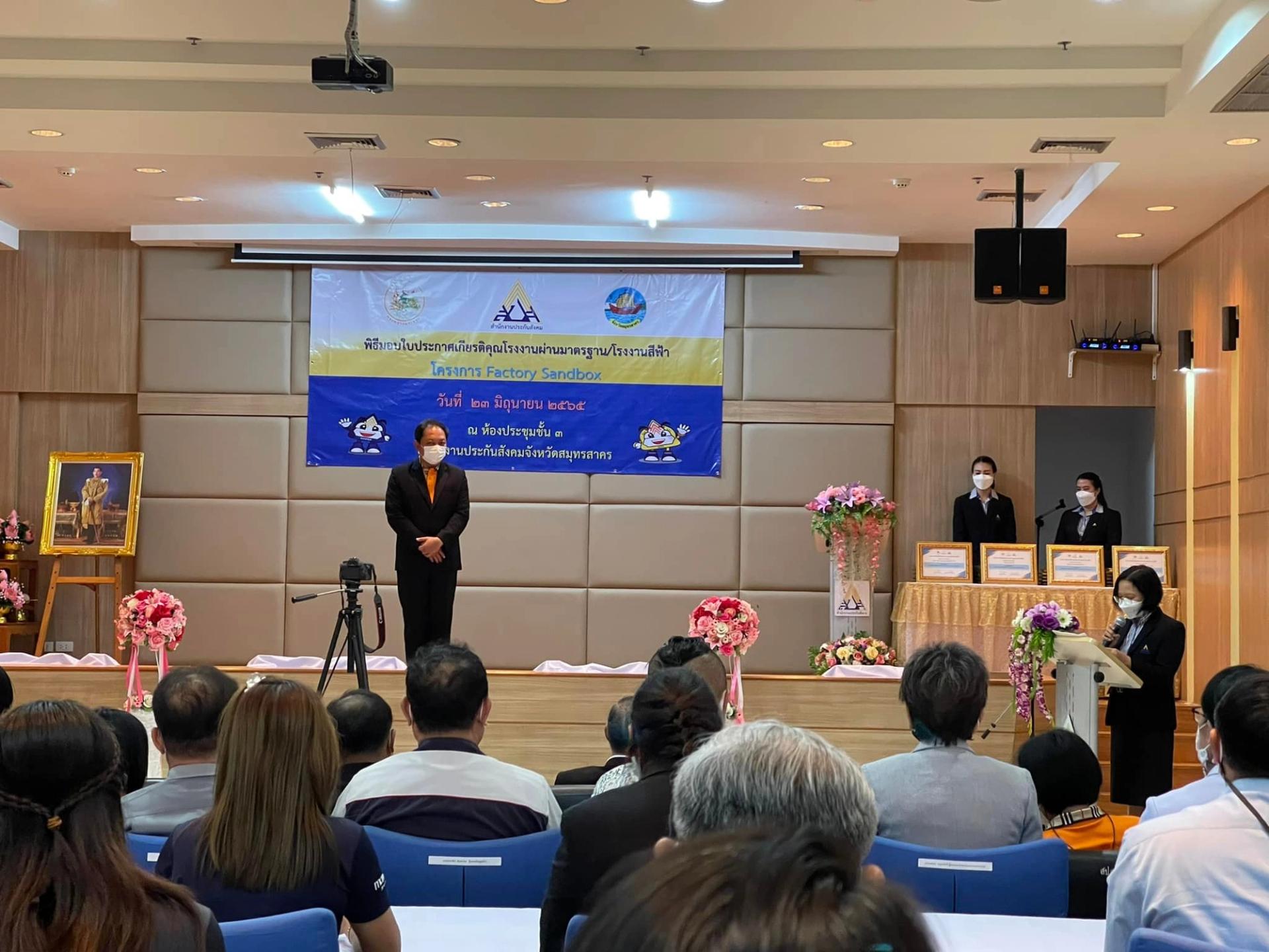  People give talks on stage and people sit in the audience.