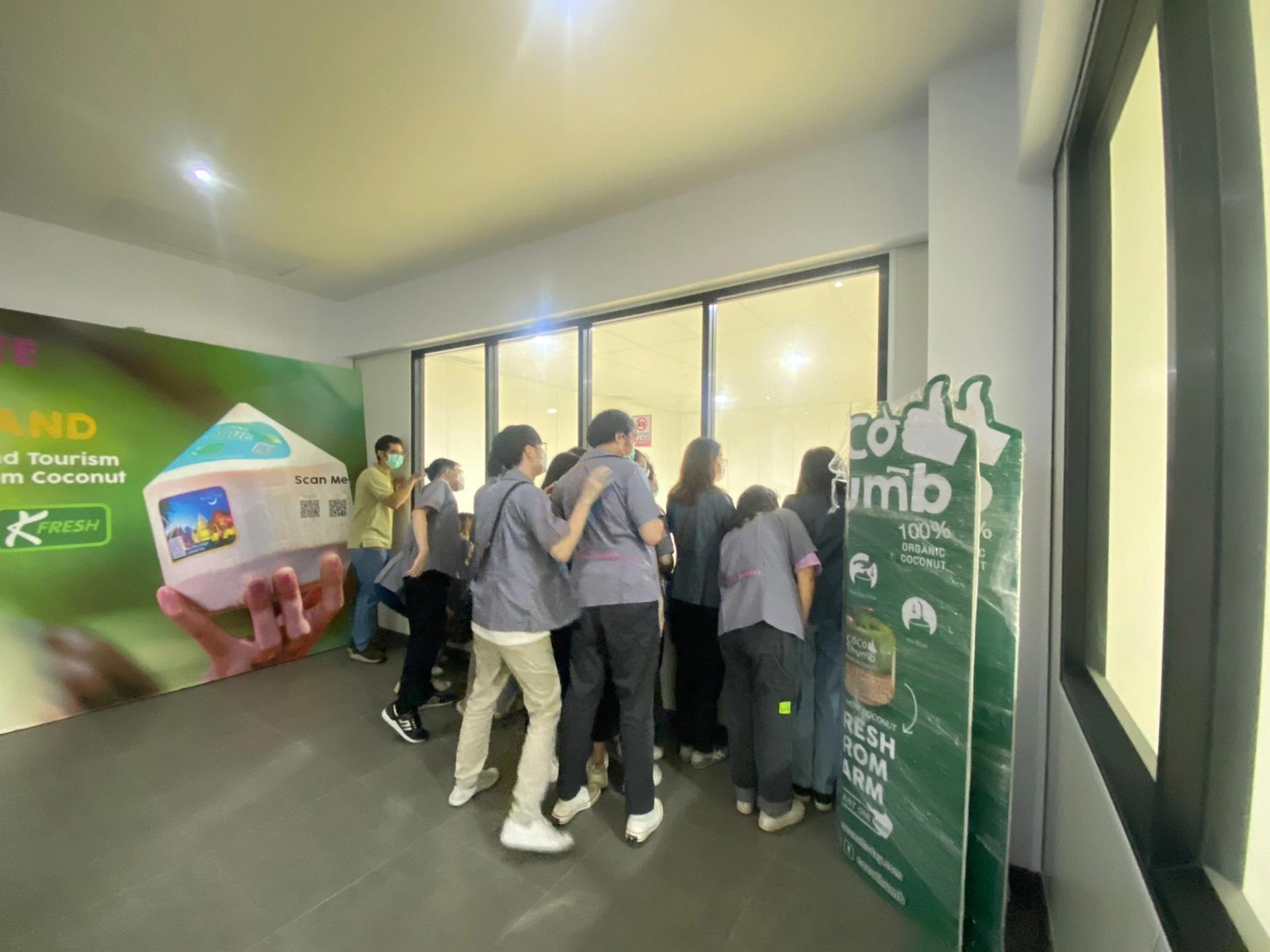 Students listening to a lecture in the factory