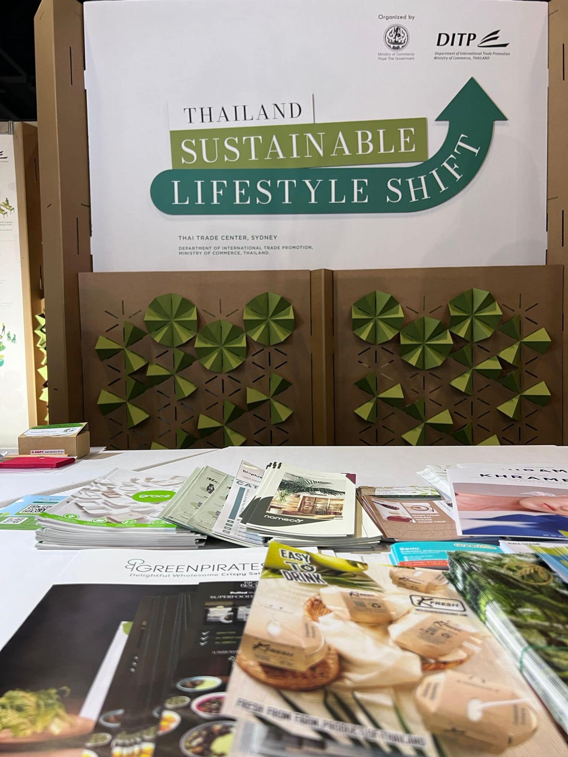 Arrange the brochures on the table.