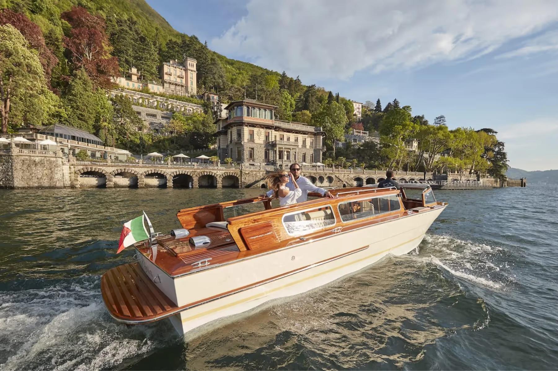 Mandarin Oriental, Lake Como: wooden platform dock extending into calm lake with mountains rising on far shore