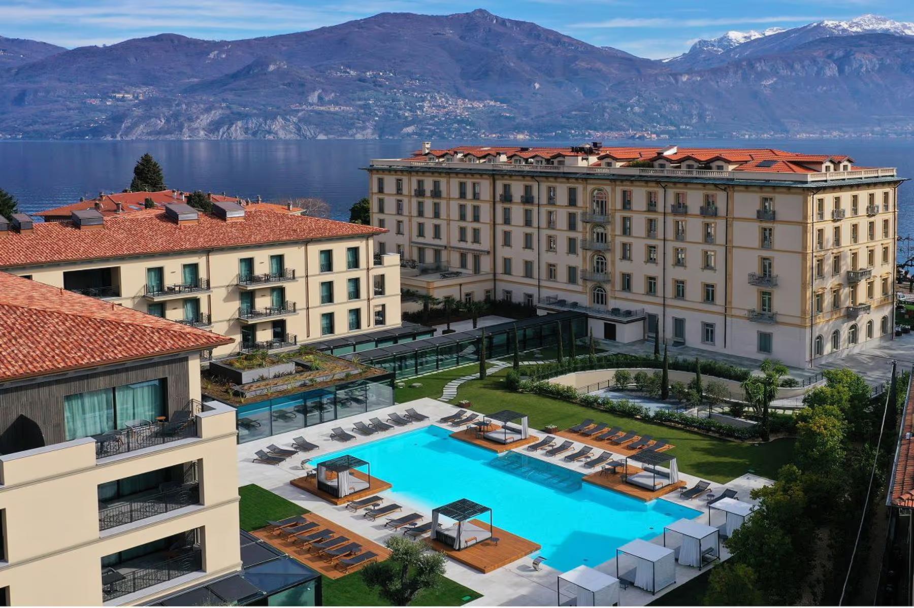 Grand Hotel Victoria Concept & Spa: the hotel and pool area viewed from above with surrounding landscape