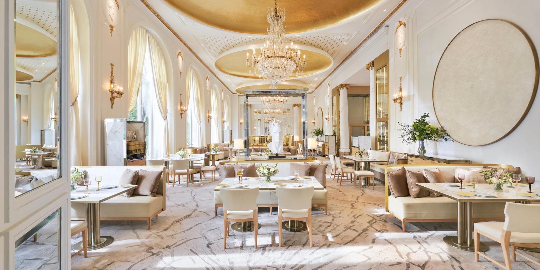 Grand Belle Époque dining room with gilt ceiling and crystal chandeliers