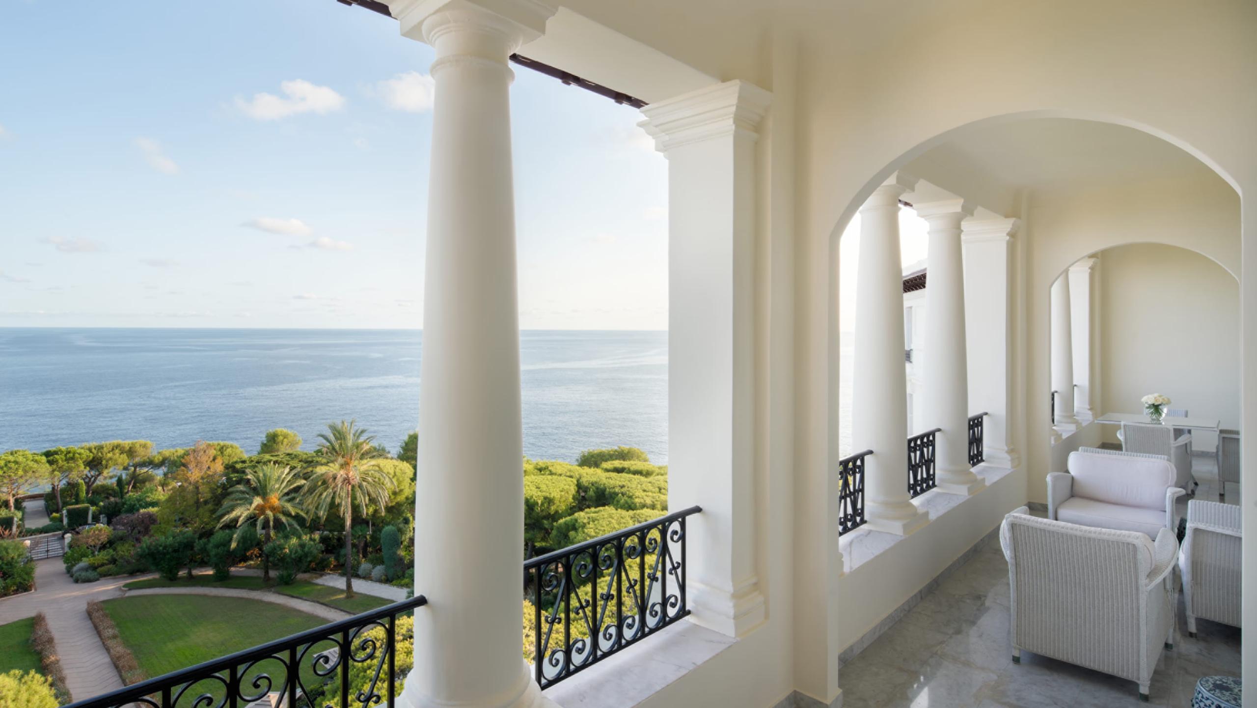 Light-filled colonnade terrace overlooking gardens and the Mediterranean
