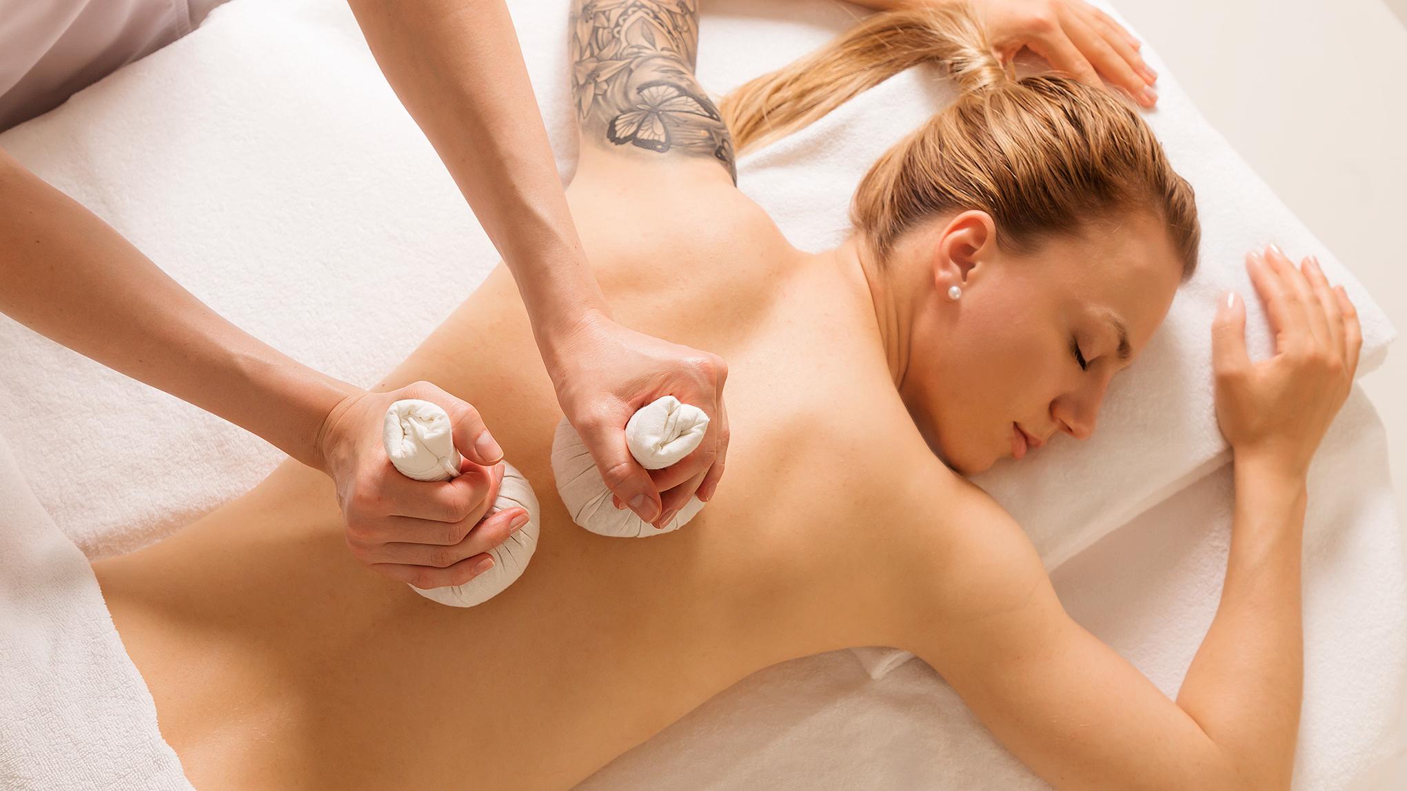 Park Hotel Vitznau: spa massage treatment with therapist applying thermal stones to guest