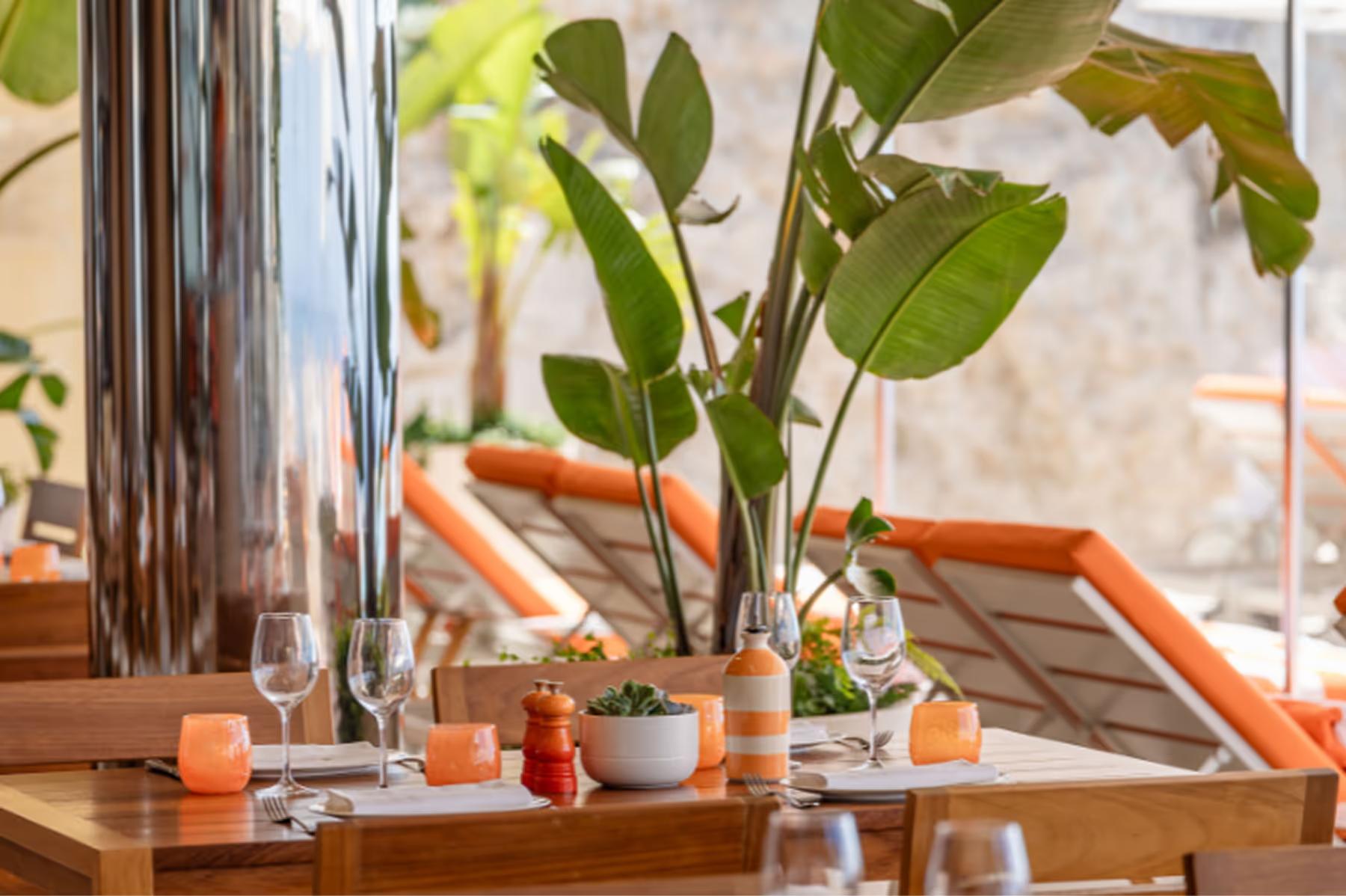 Intimate table setting with fresh flowers and sea view