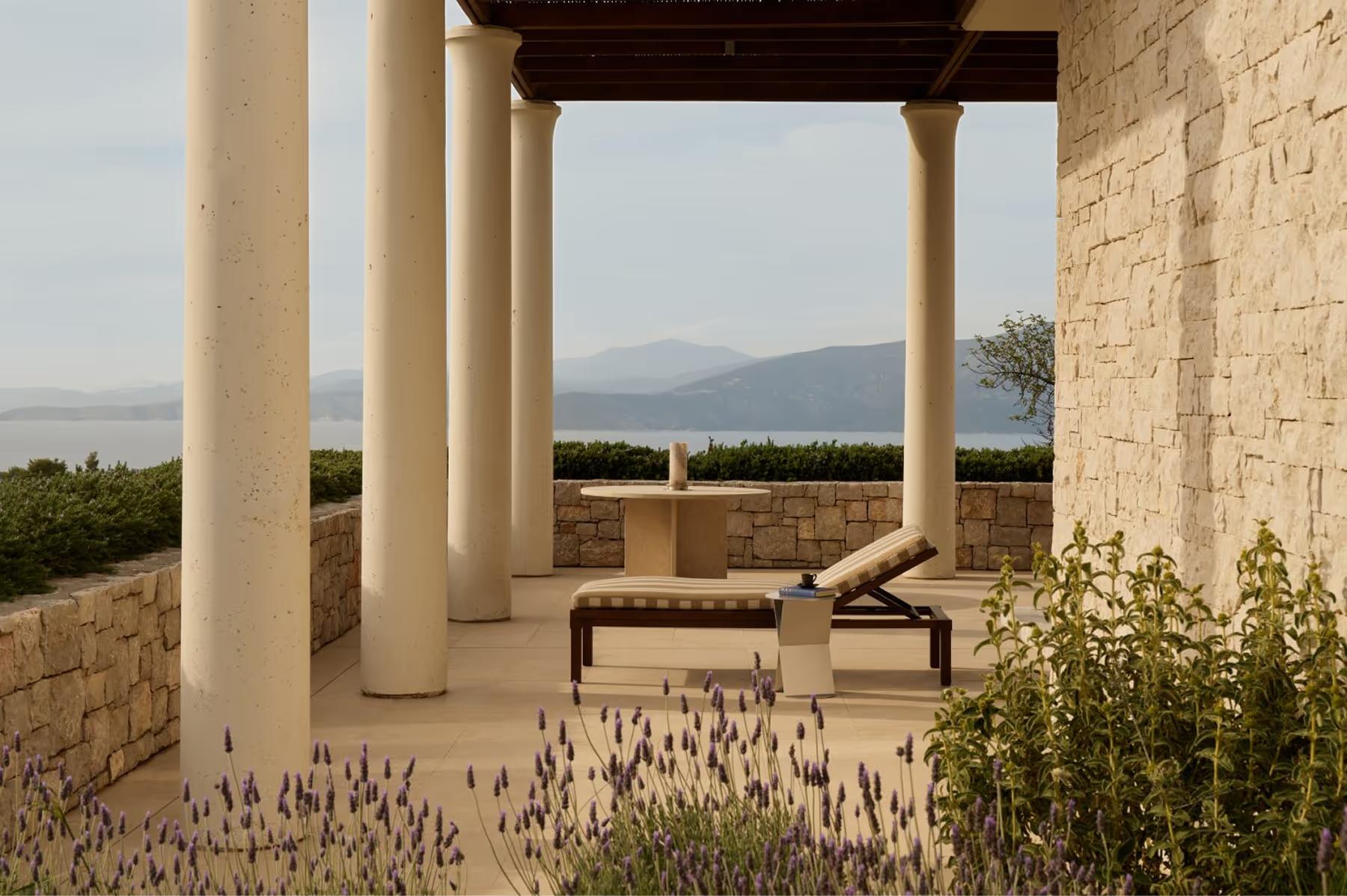 Amanzoe: columned terrace with mountain vistas and contemporary outdoor seating