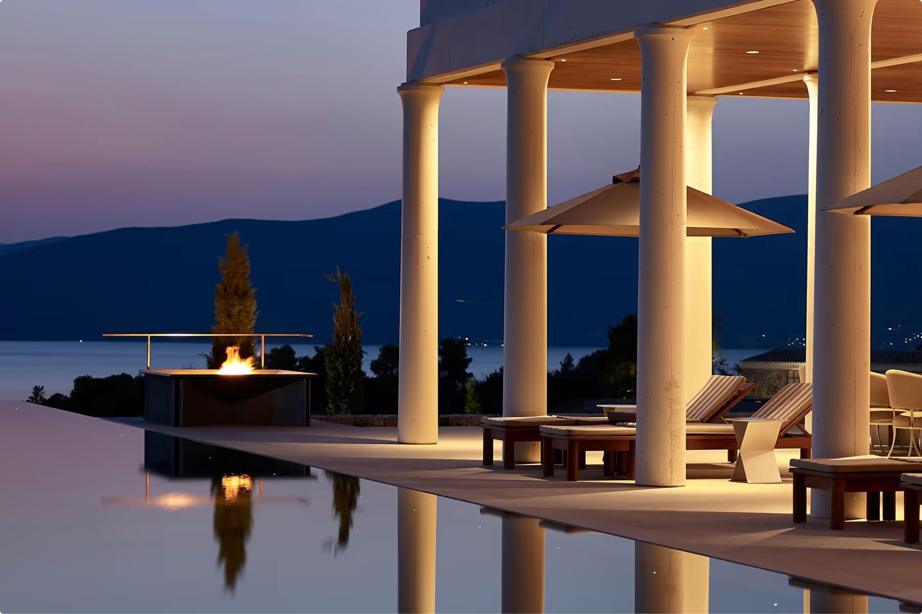Infinity pool at dusk with columned structure and Aegean views