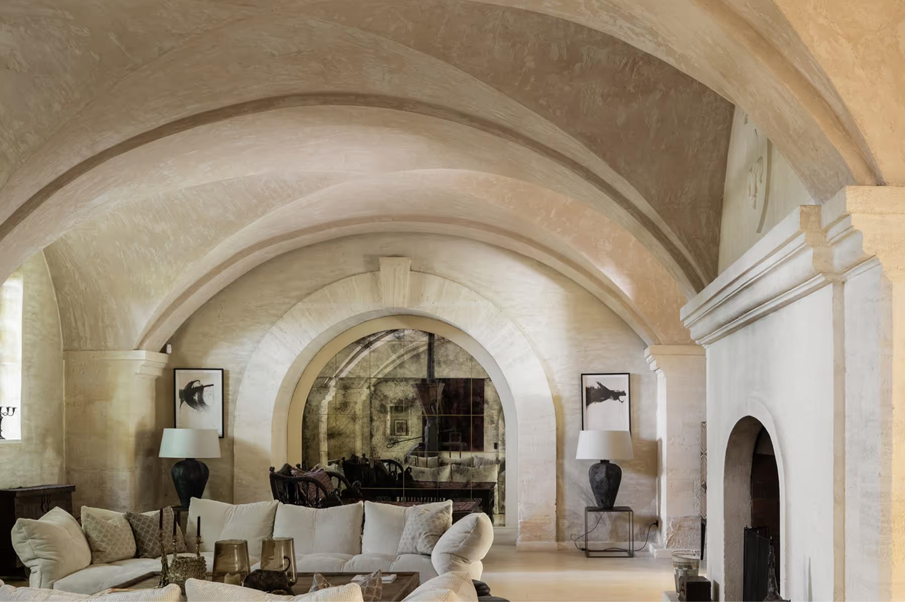 Vaulted barrel ceiling in limestone with generous seating and natural light from side openings