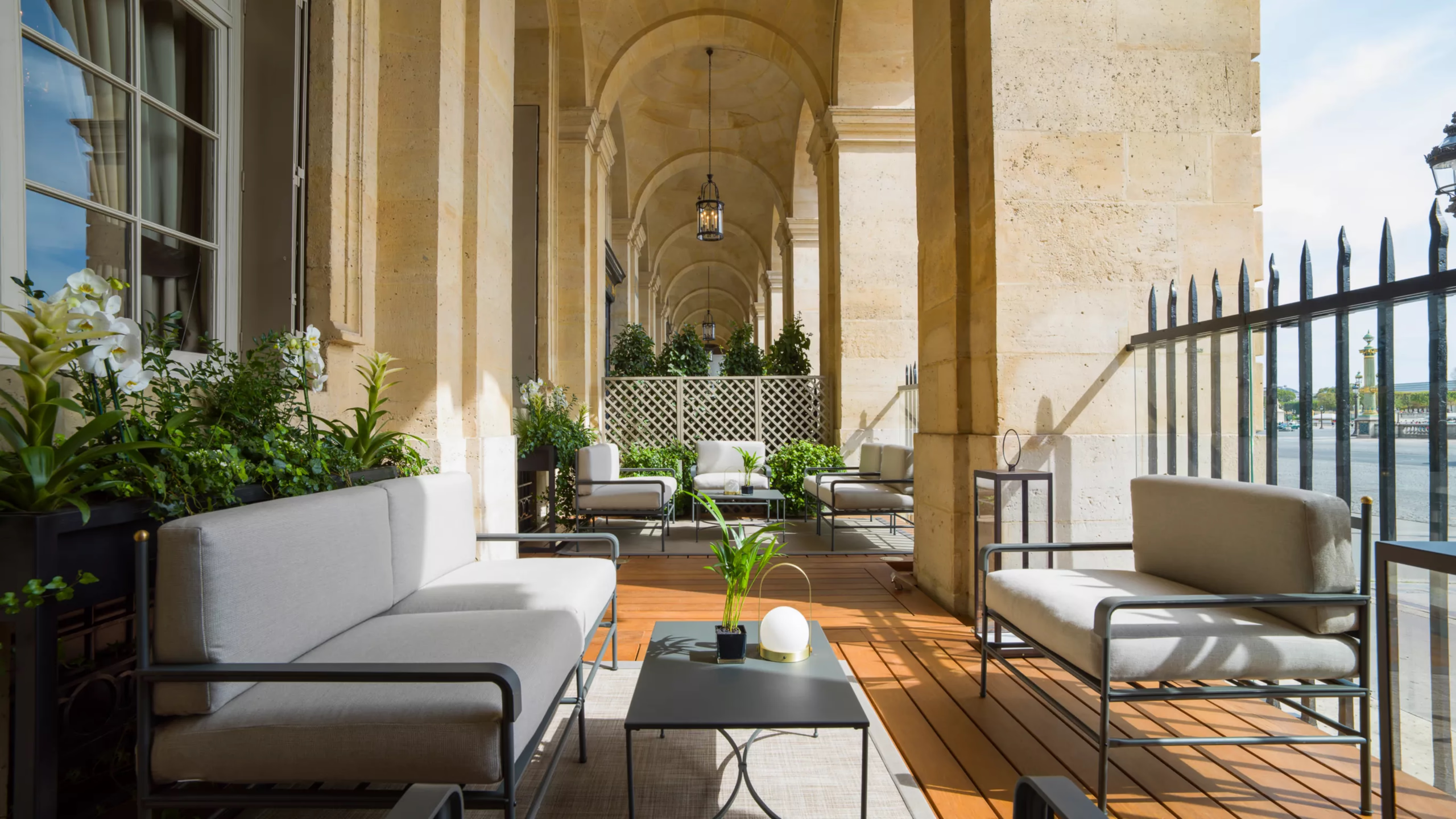 Hôtel de Crillon: classical courtyard with arched stone ceiling, ornate railings, and sculptural details