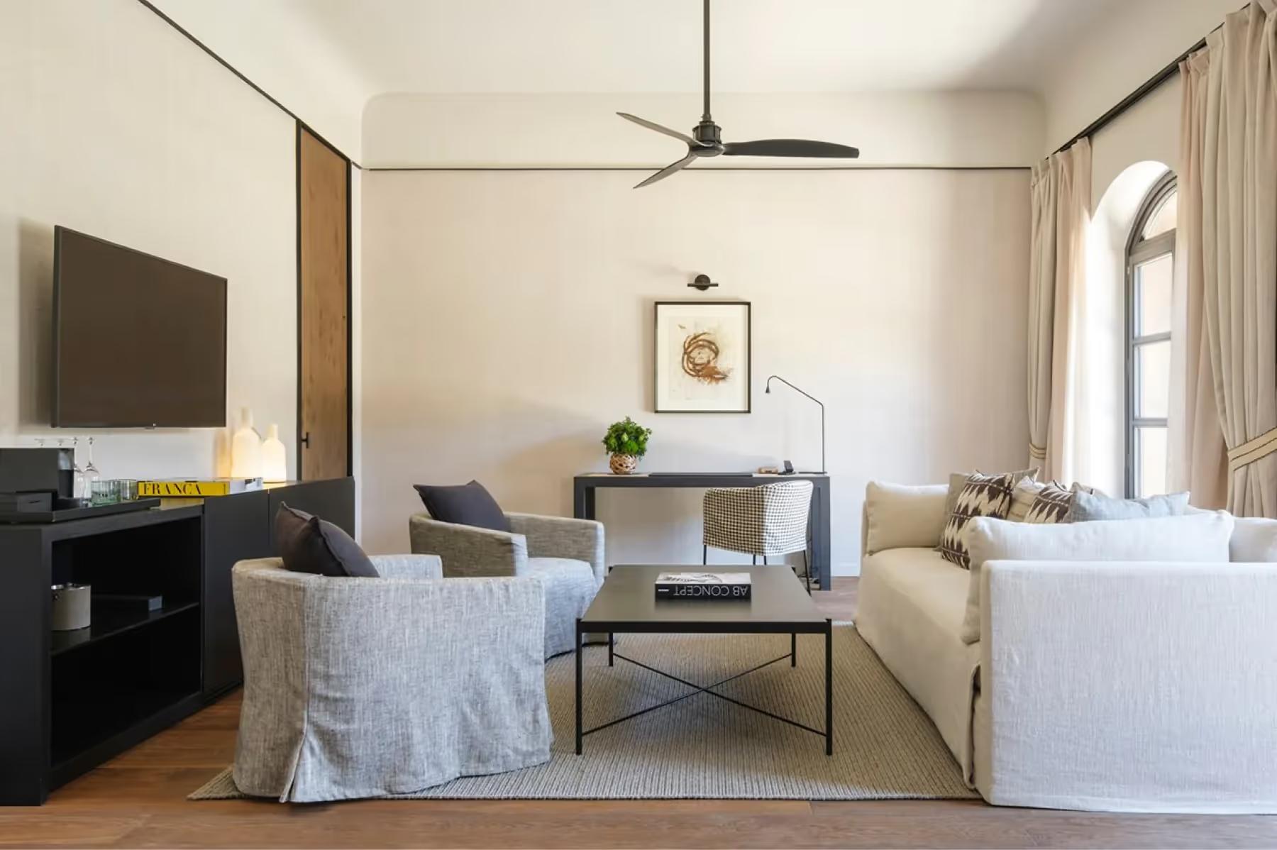 Suite with warm palette and designer furnishings