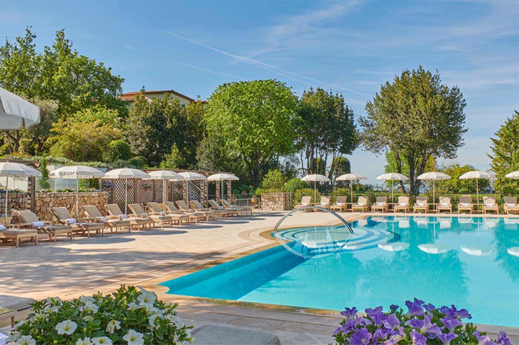 Château Saint Martin & Spa: infinity pool with hills and cypress trees in the background