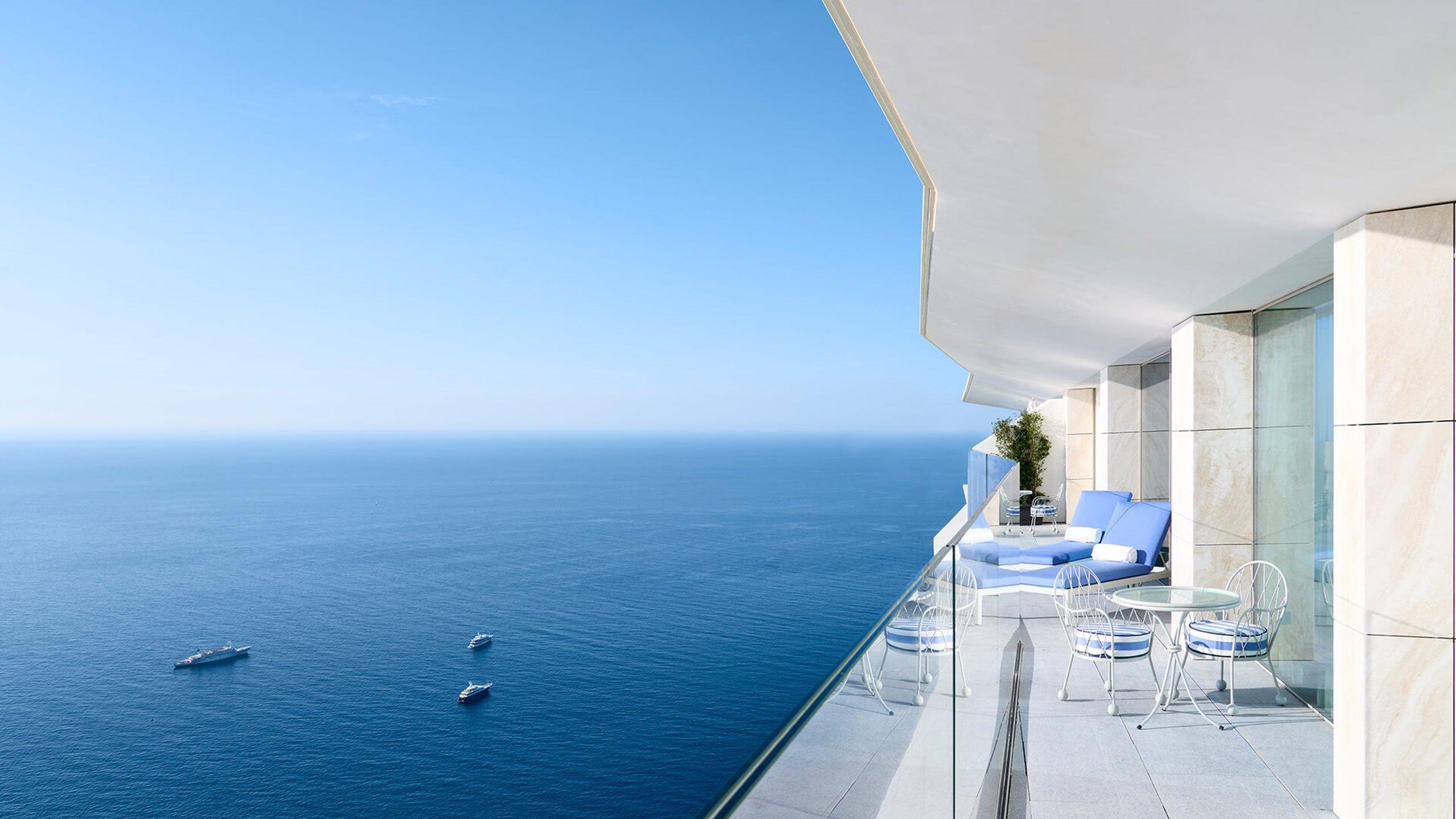 Maybourne Riviera: infinity pool and terraced seating overlooking blue water