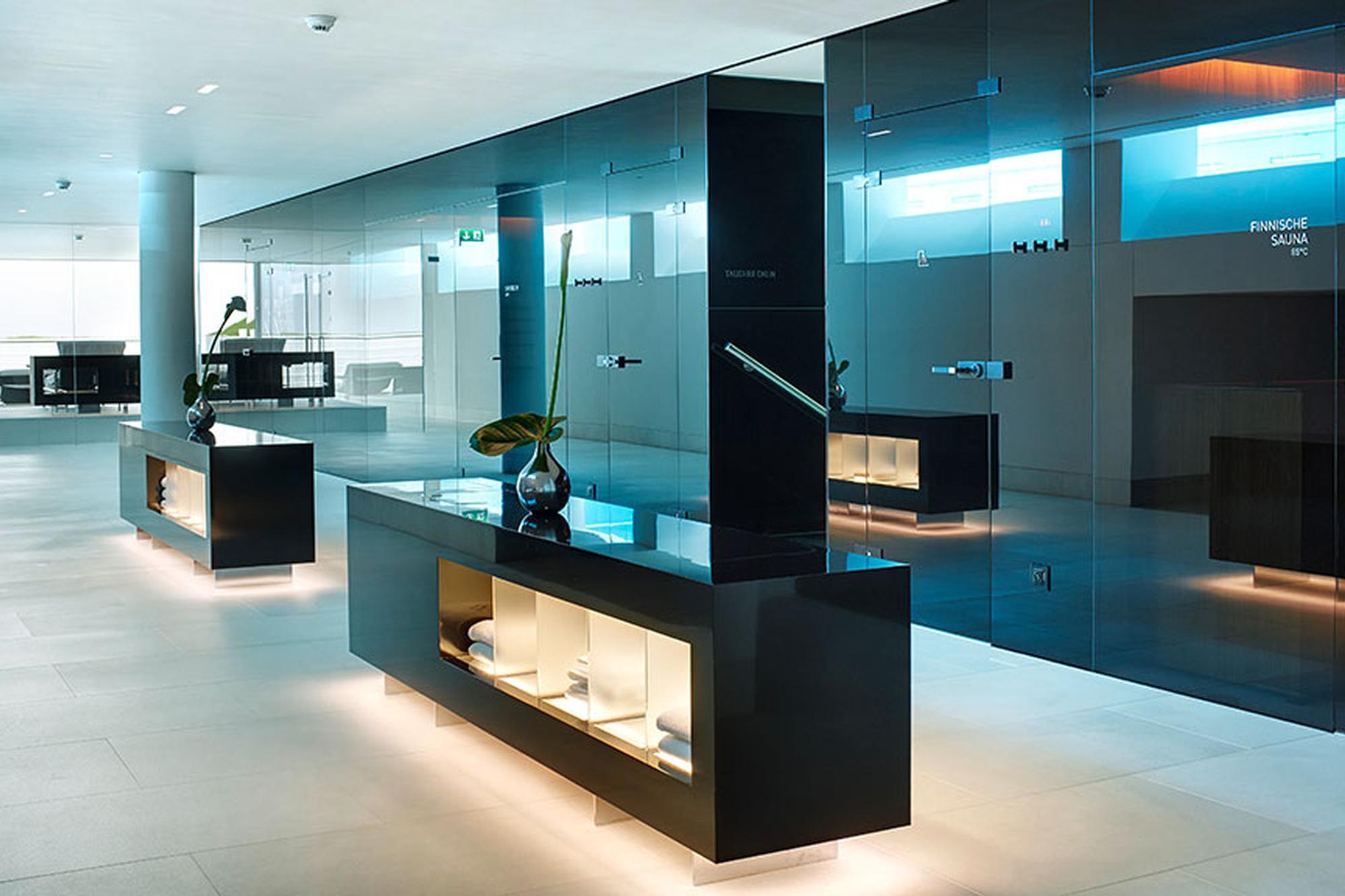 Park Hotel Vitznau: spa reception area with turquoise blue lighting and glass dividers