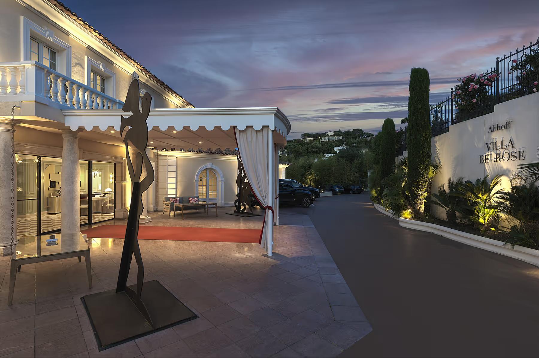 Illuminated terraced exterior at dusk with spa facilities and sea views