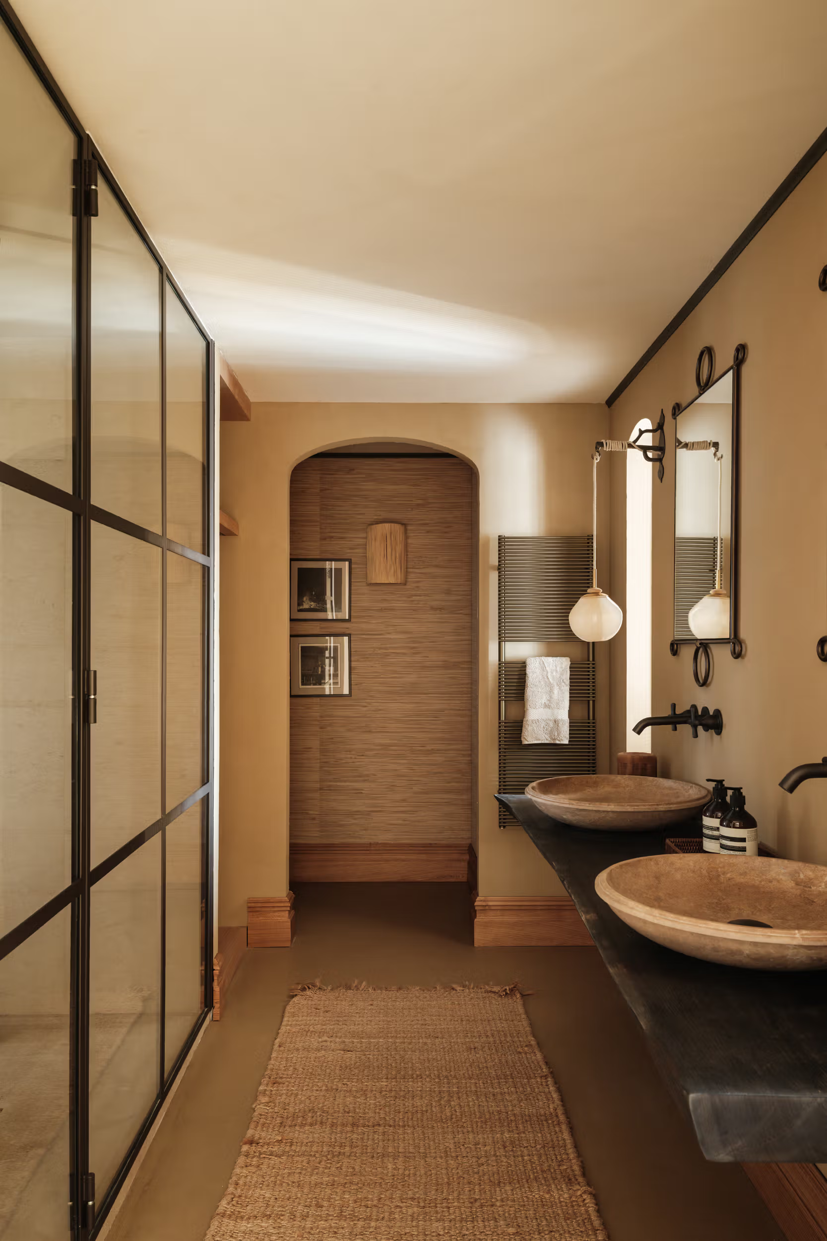 La Bergerie: dressing alcove with floor-length curtains, tall framed mirror, patterned woven stool, crisp white shelving