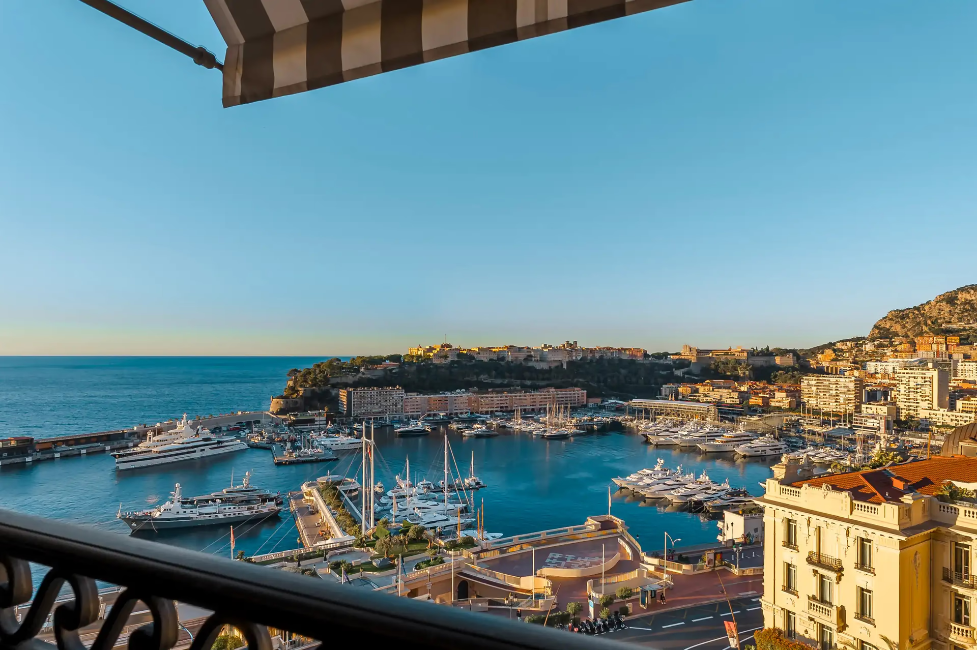 Hôtel de Paris Monte-Carlo: view from balcony toward harbor with boats and yachts, Mediterranean in distance