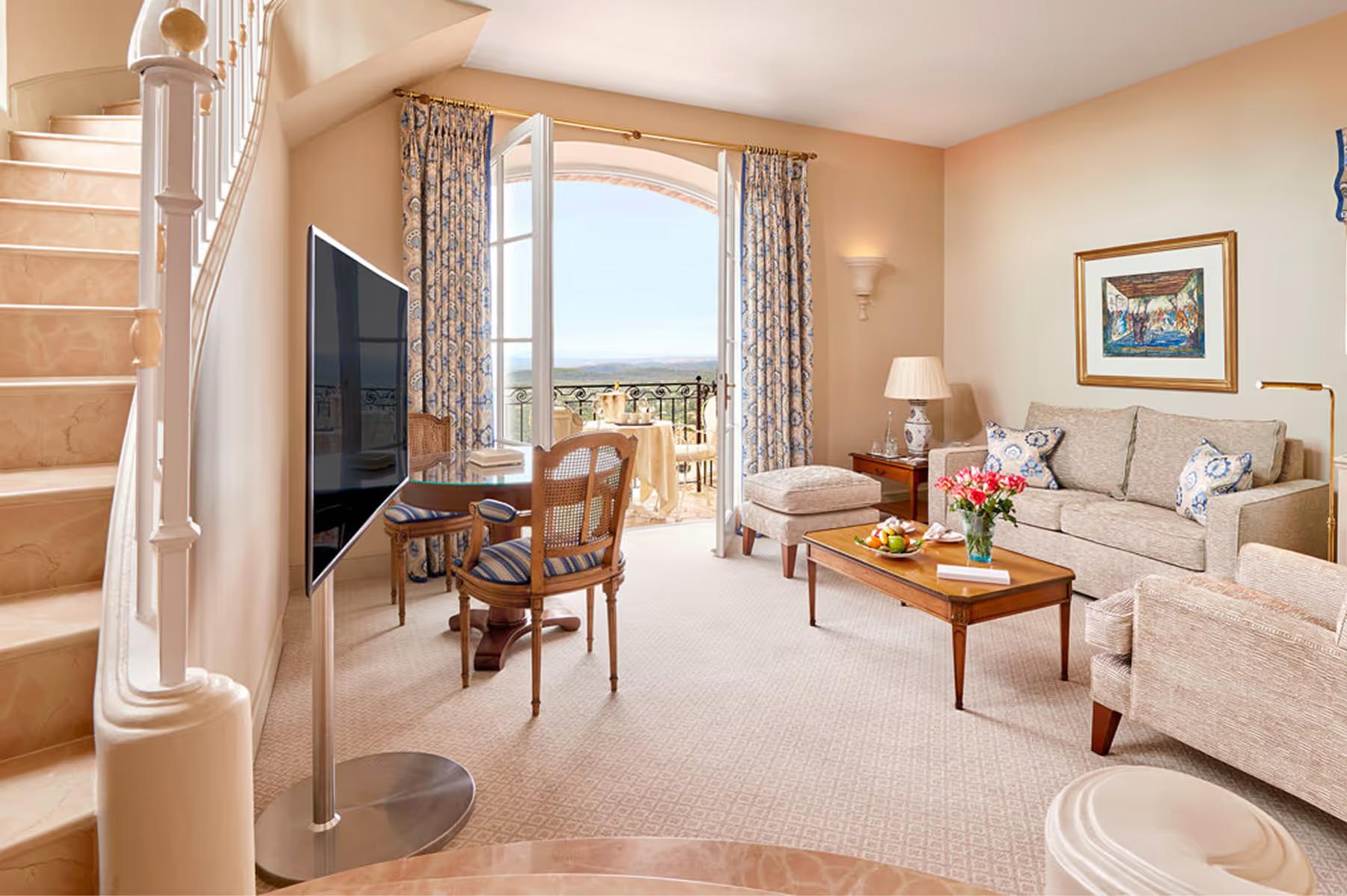 Château Saint Martin & Spa: suite bedroom with access to a living area and terrace views