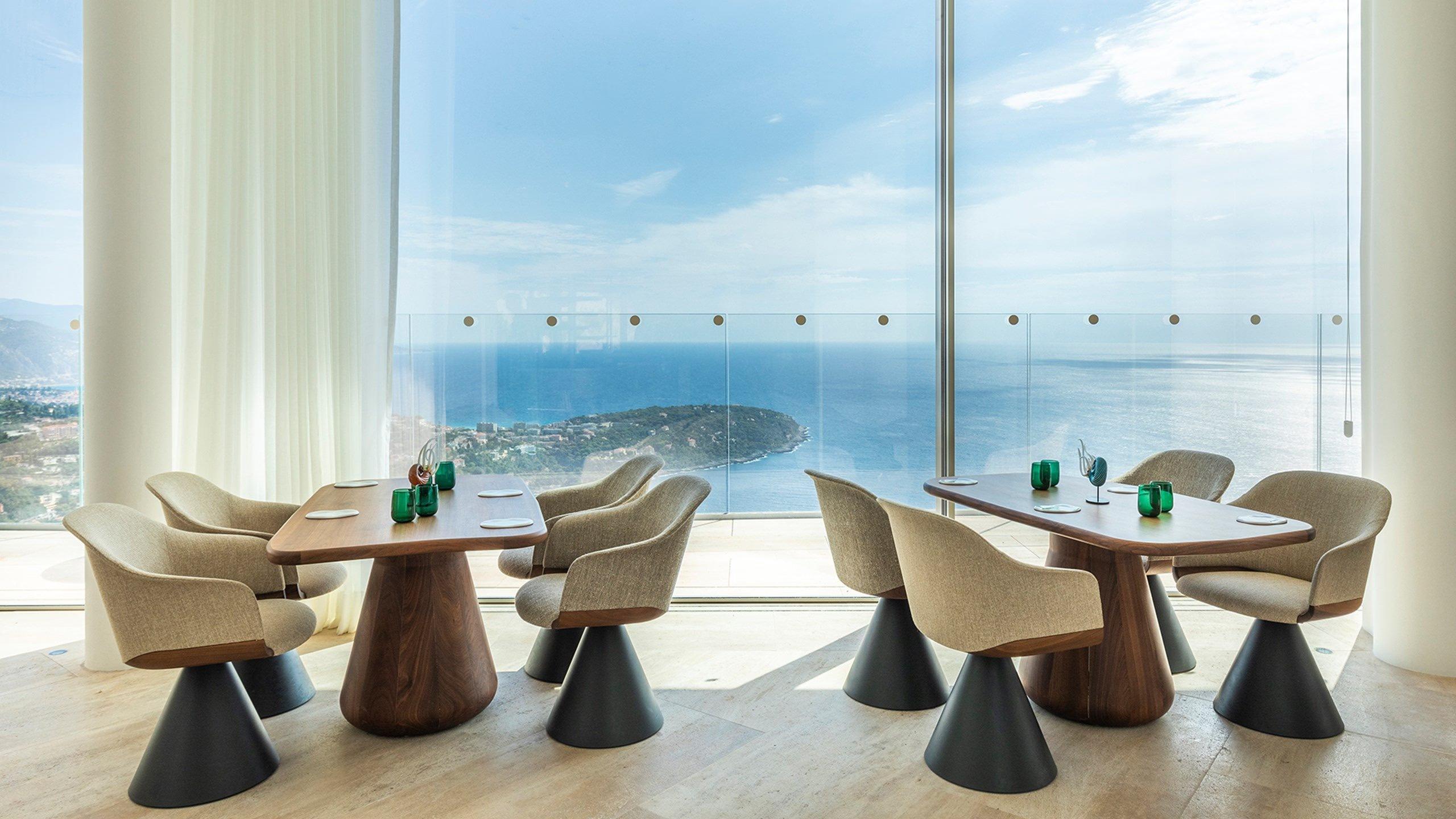 Maybourne Riviera: dining lounge with blue chairs and sea view
