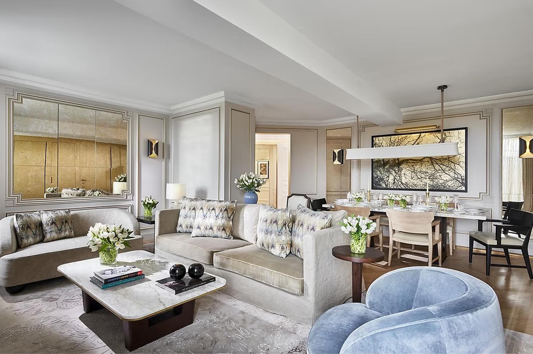 Mandarin Oriental Ritz, Madrid: suite with integrated seating, workspace, and soft furnishings in neutral tones