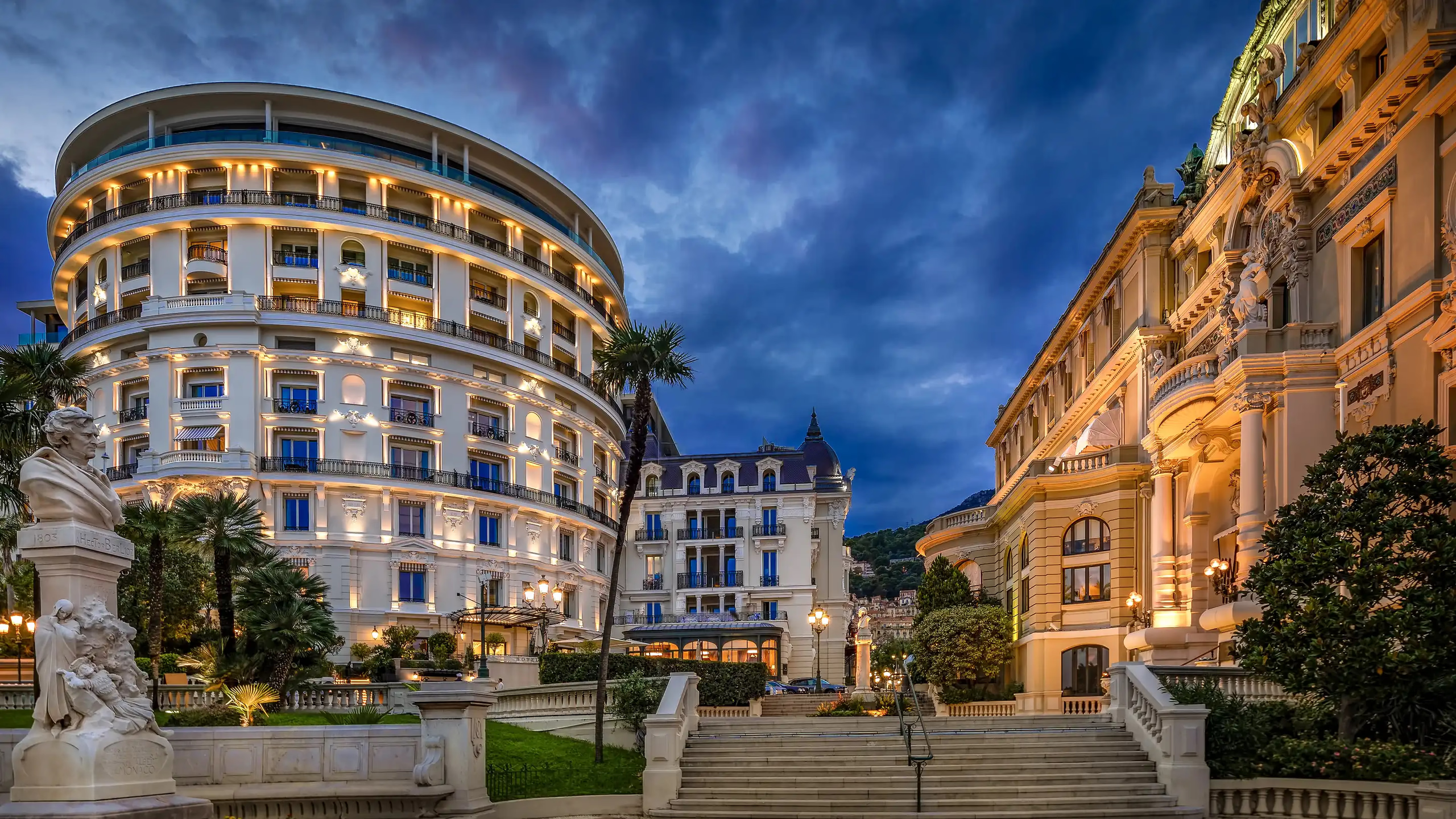 Hôtel de Paris Monte-Carlo: Place du Casino at dusk with lit palazzo and surrounding buildings