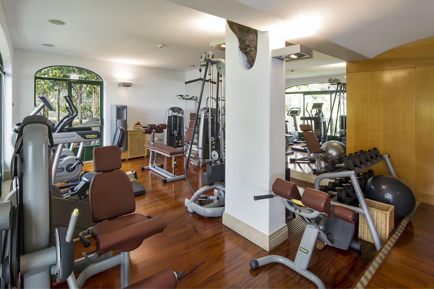 Fitness center with treadmills, functional equipment, and bright interior spaces