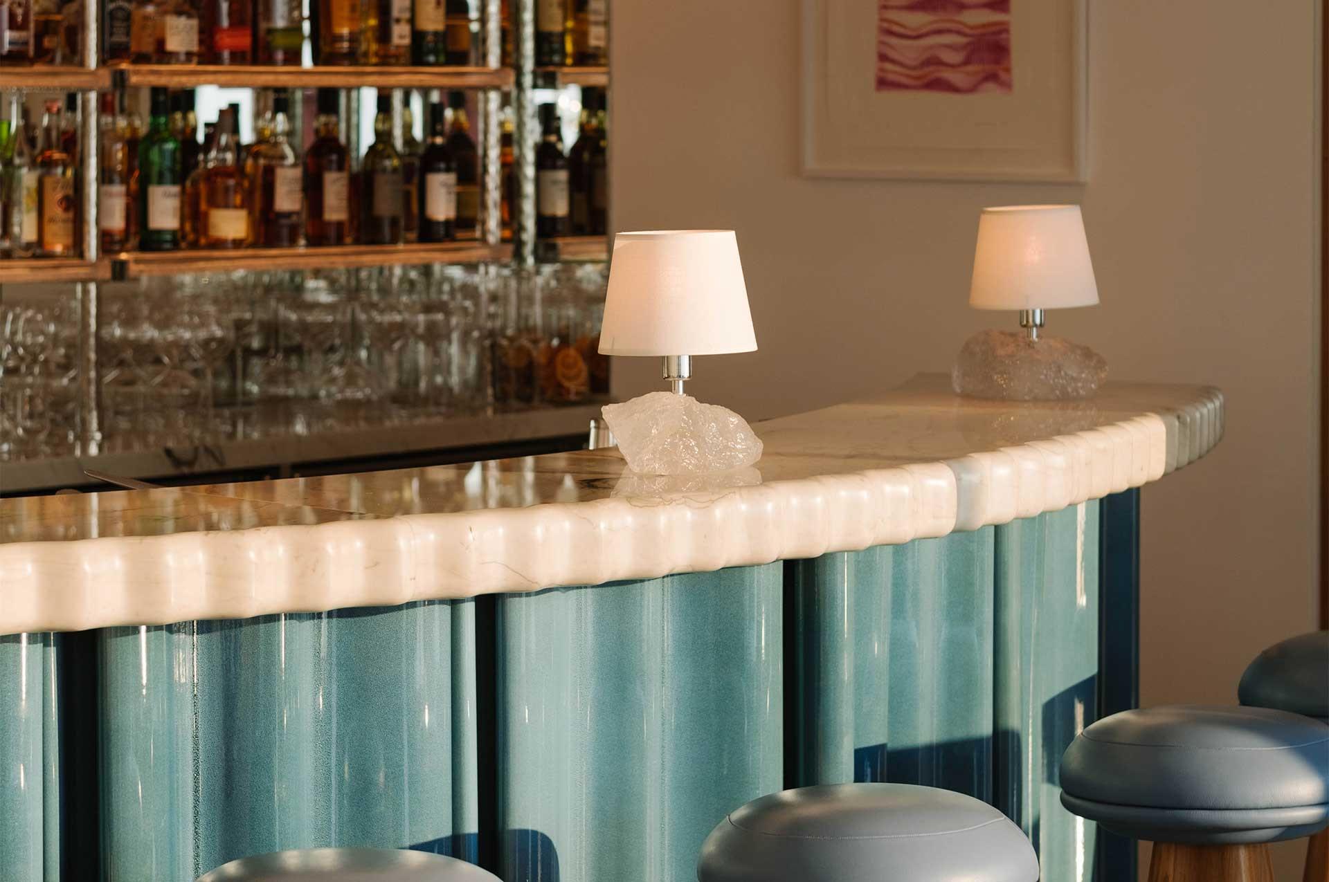 Maybourne Riviera: bar counter with marble surface and bottle display