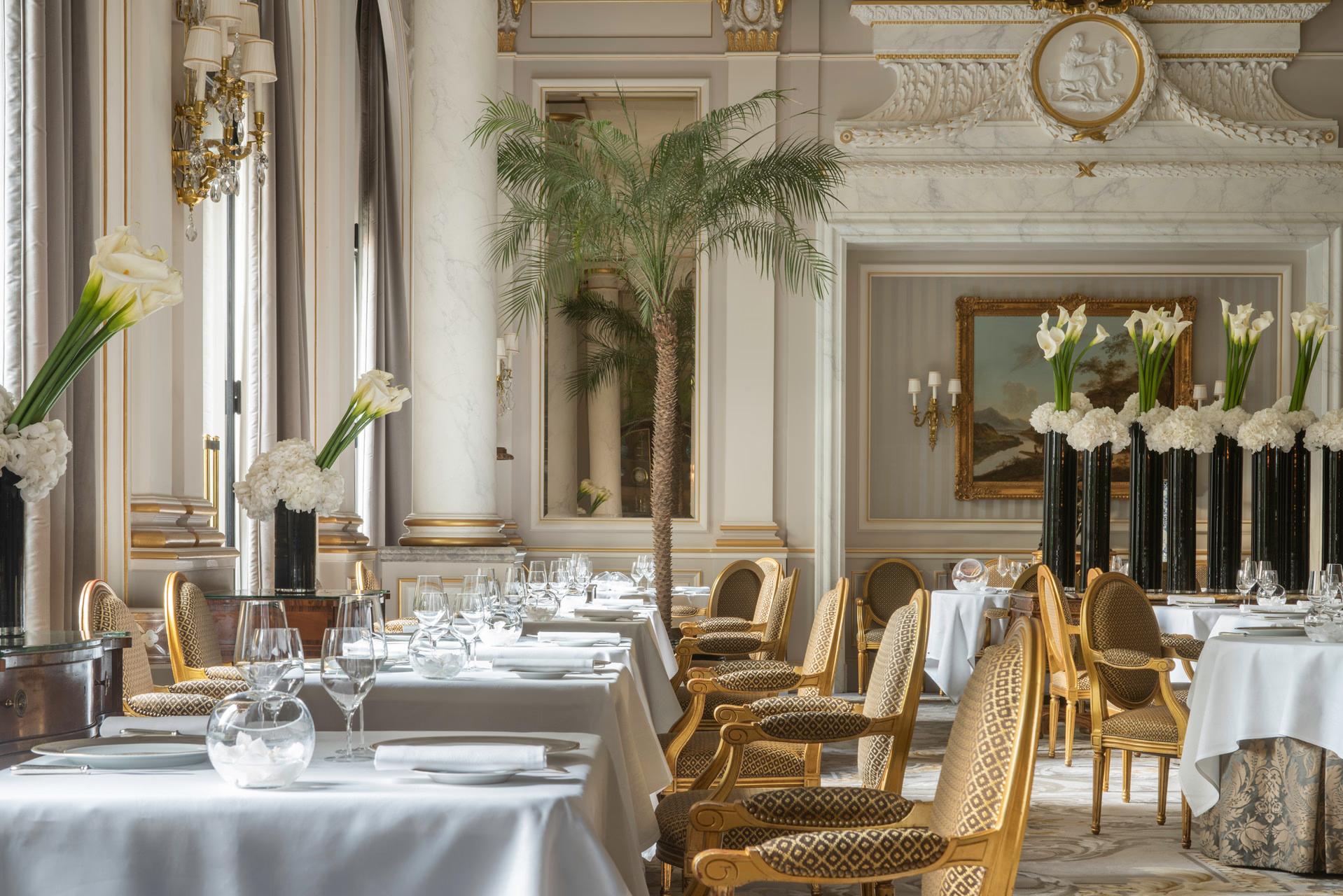 Four Seasons Hotel George V: a rich wood-paneled bar with warm lighting and leather seating