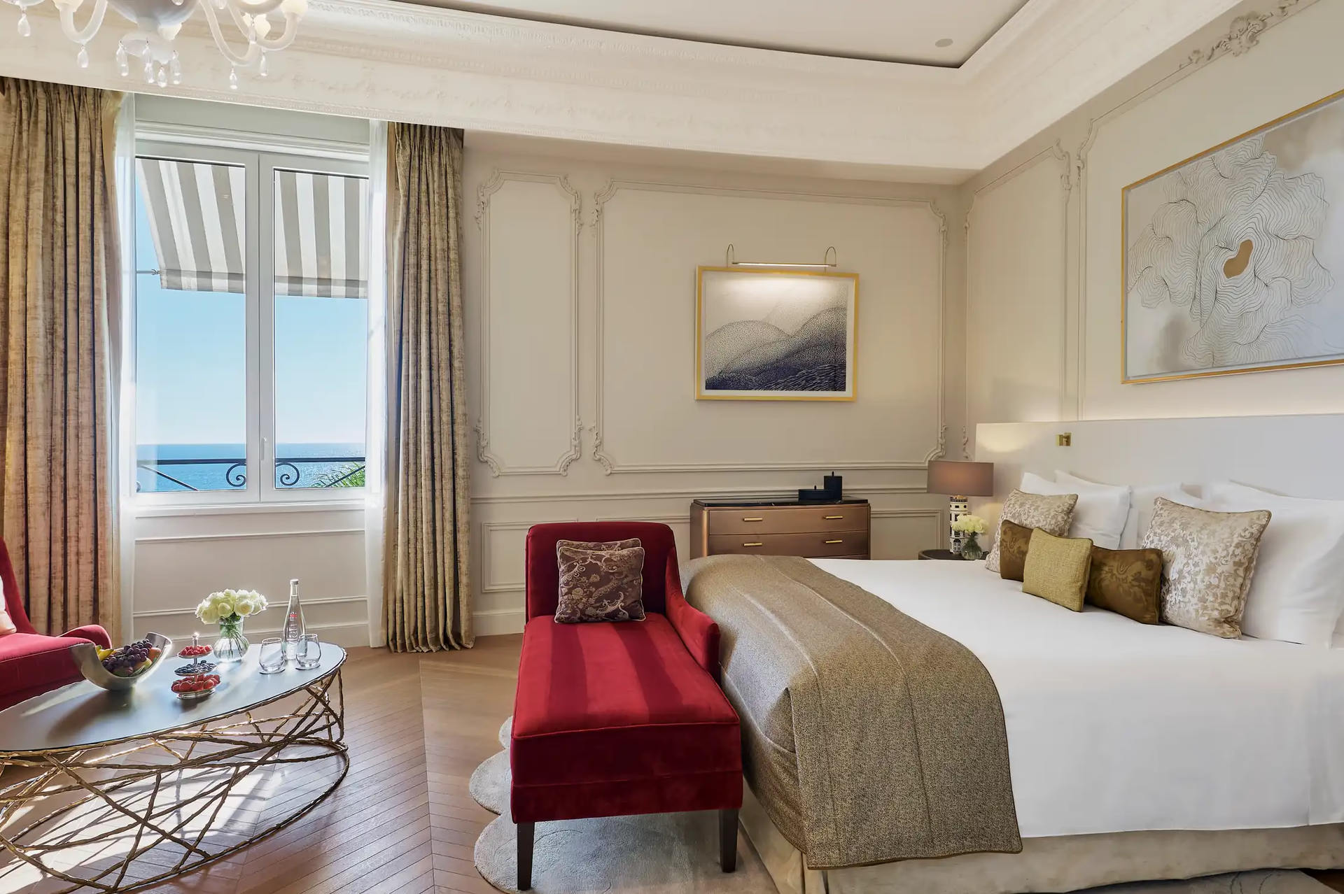 Hôtel de Paris Monte-Carlo: bedroom with white bed and red accent bench at foot, sea view window