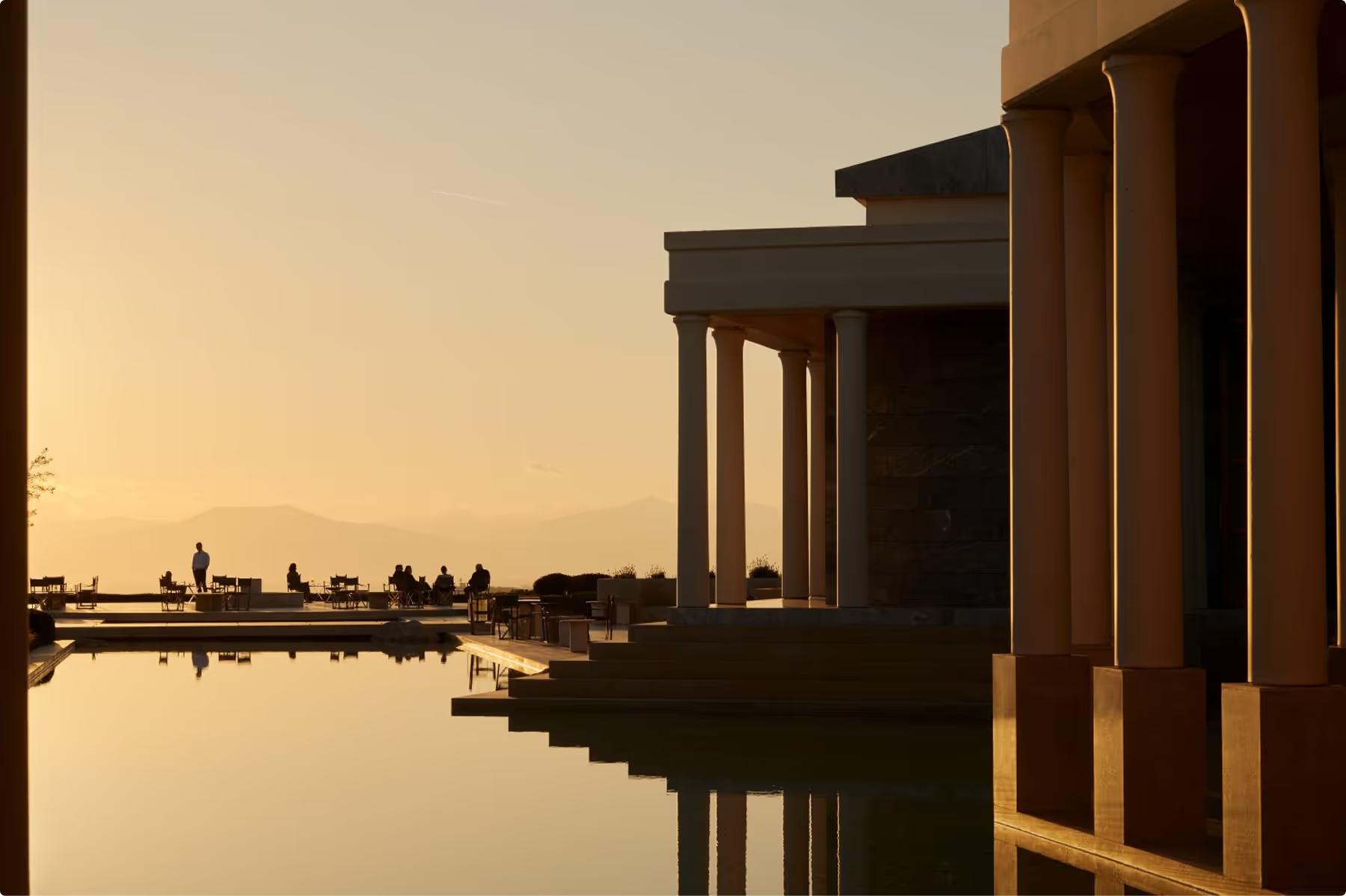 Amanzoe: interior detail with water reflection and columned architecture