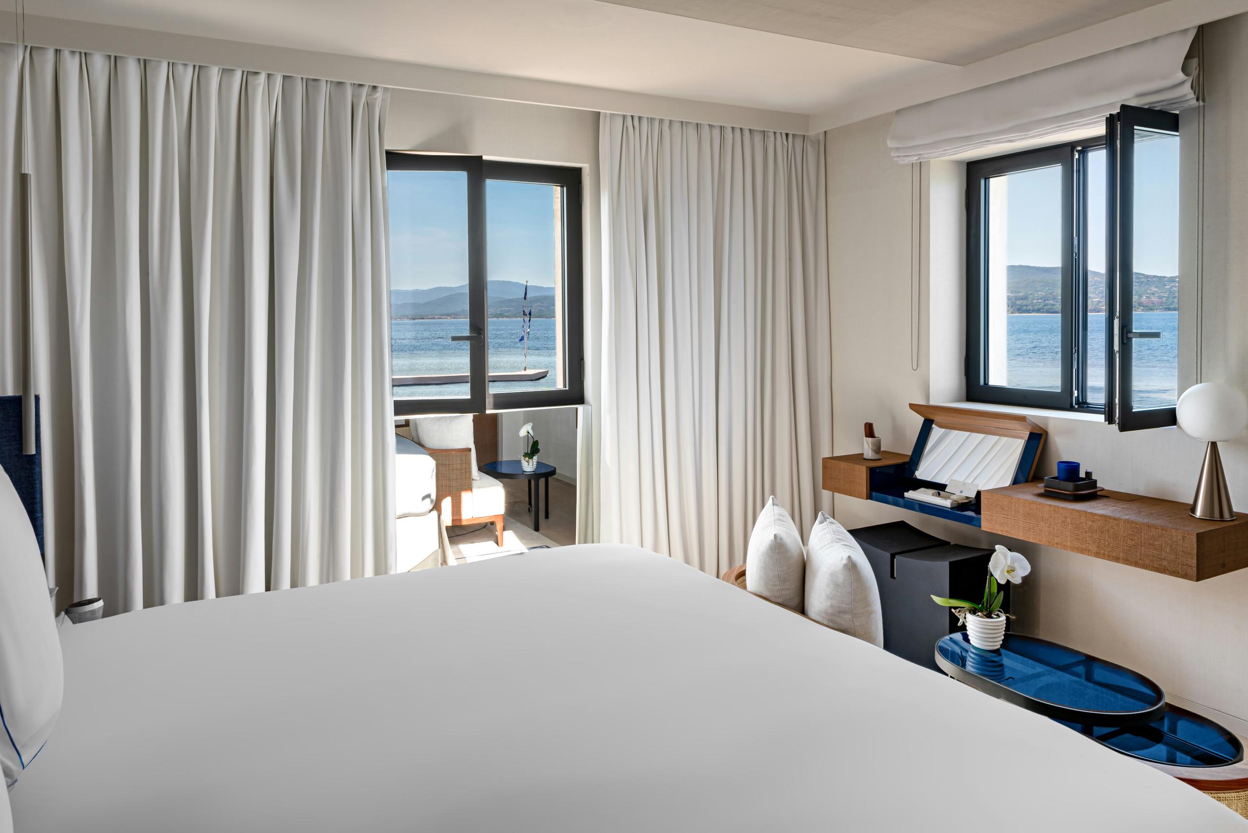 Cheval Blanc St-Tropez: bedroom with floor-to-ceiling terrace doors and water vista