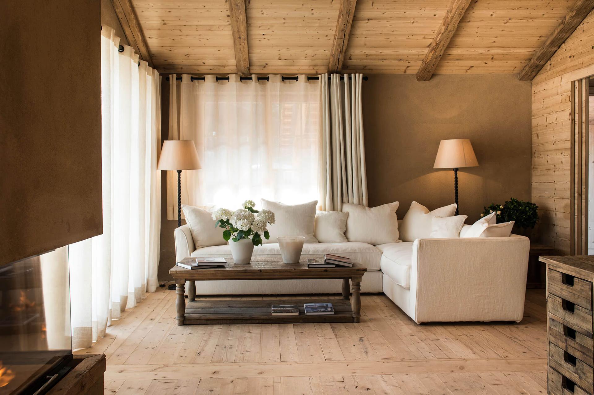 San Luis Retreat: bedroom suite with cream upholstered furniture and large windows overlooking greenery