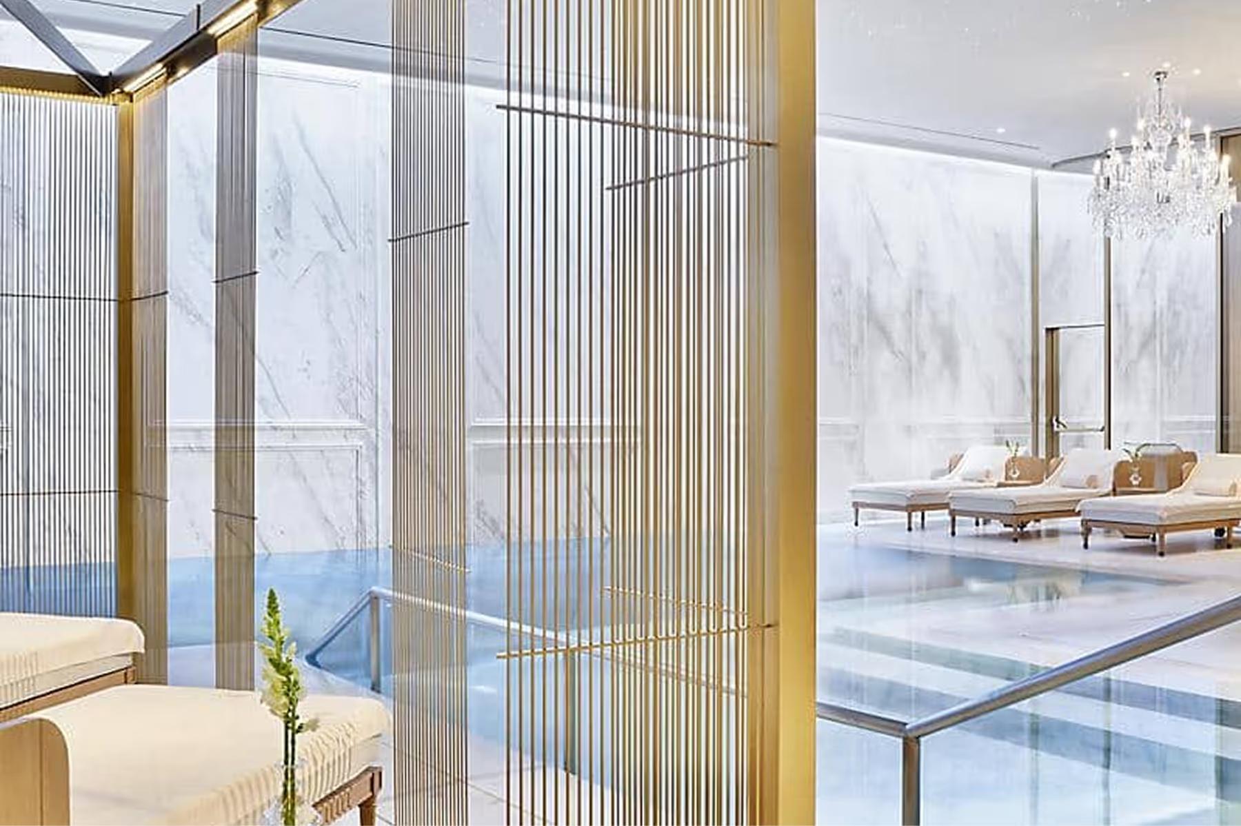 Spa treatment area with gold-leaf accents and lounge seating
