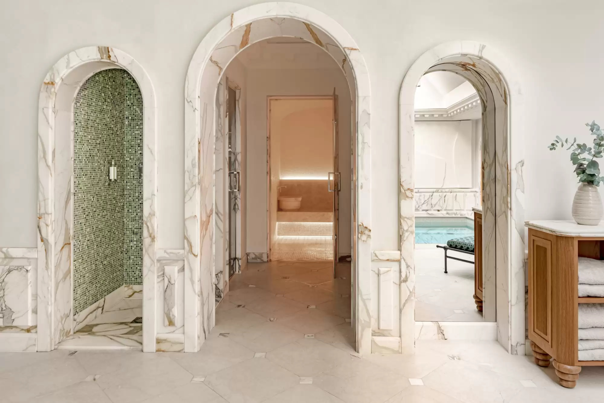 Saint James: classical corridor with arched marble doorways and natural light