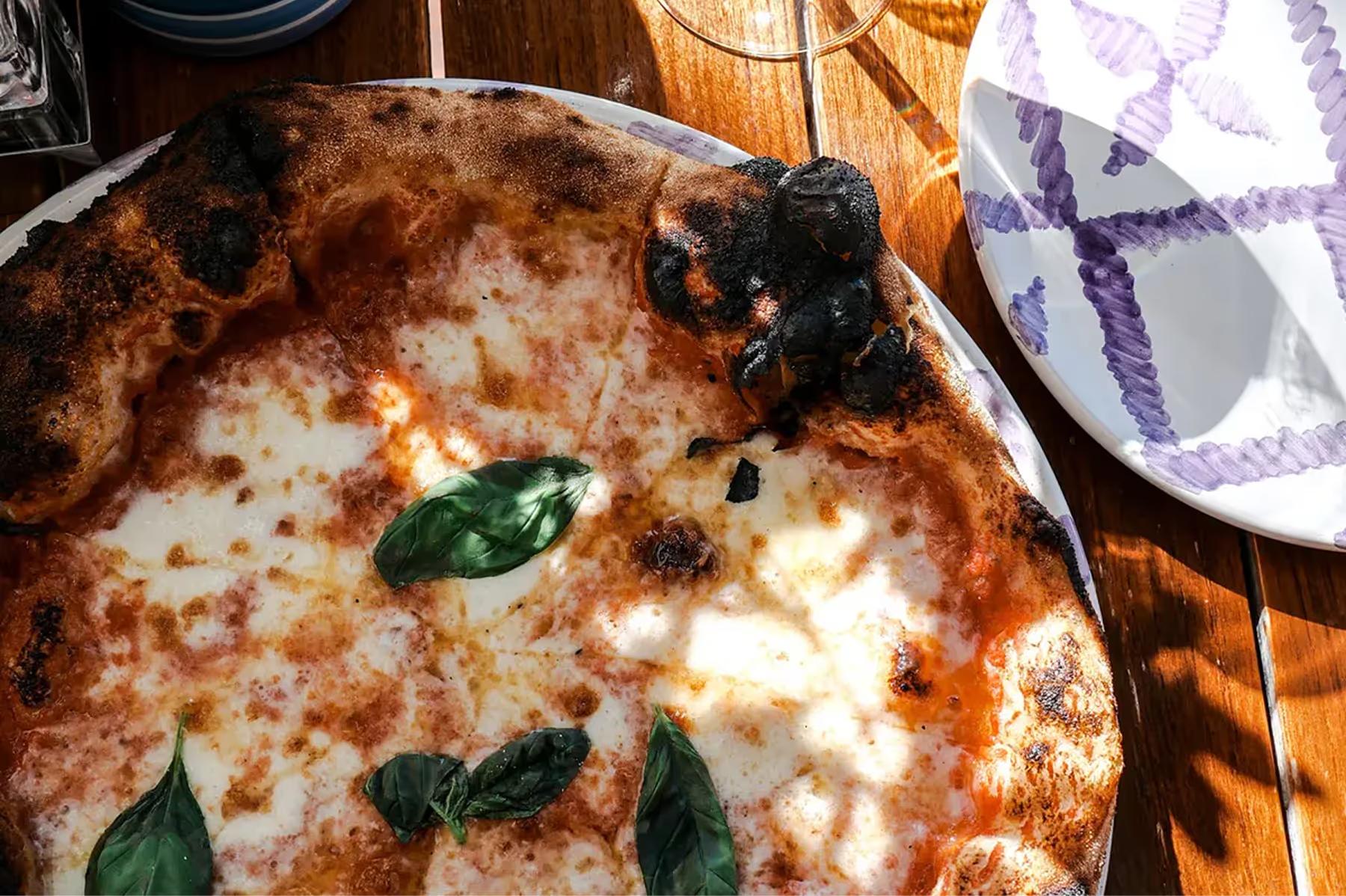 Grand Hotel Tremezzo: a personal-size pizza with cheese and basil leaf