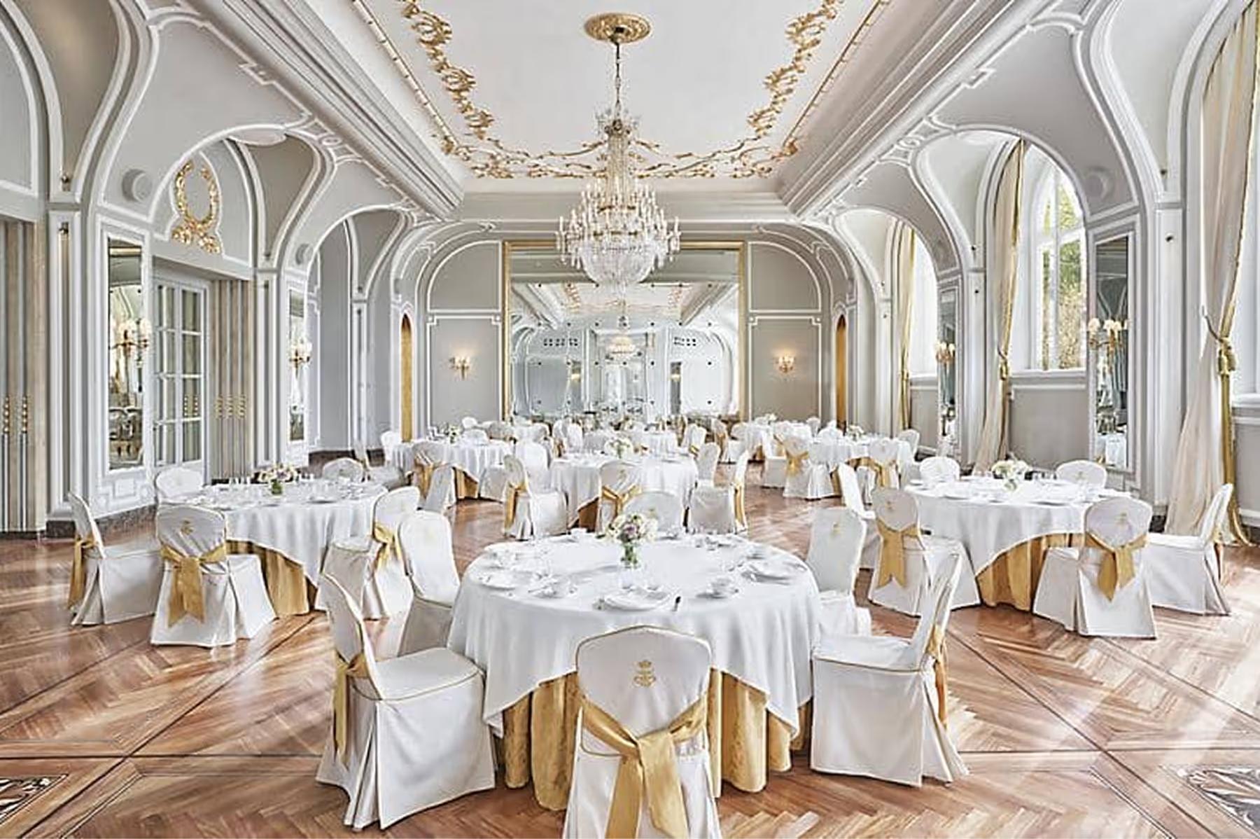 Mandarin Oriental Ritz, Madrid: formal banquet hall with gold chairs, white linens, and arched architectural details