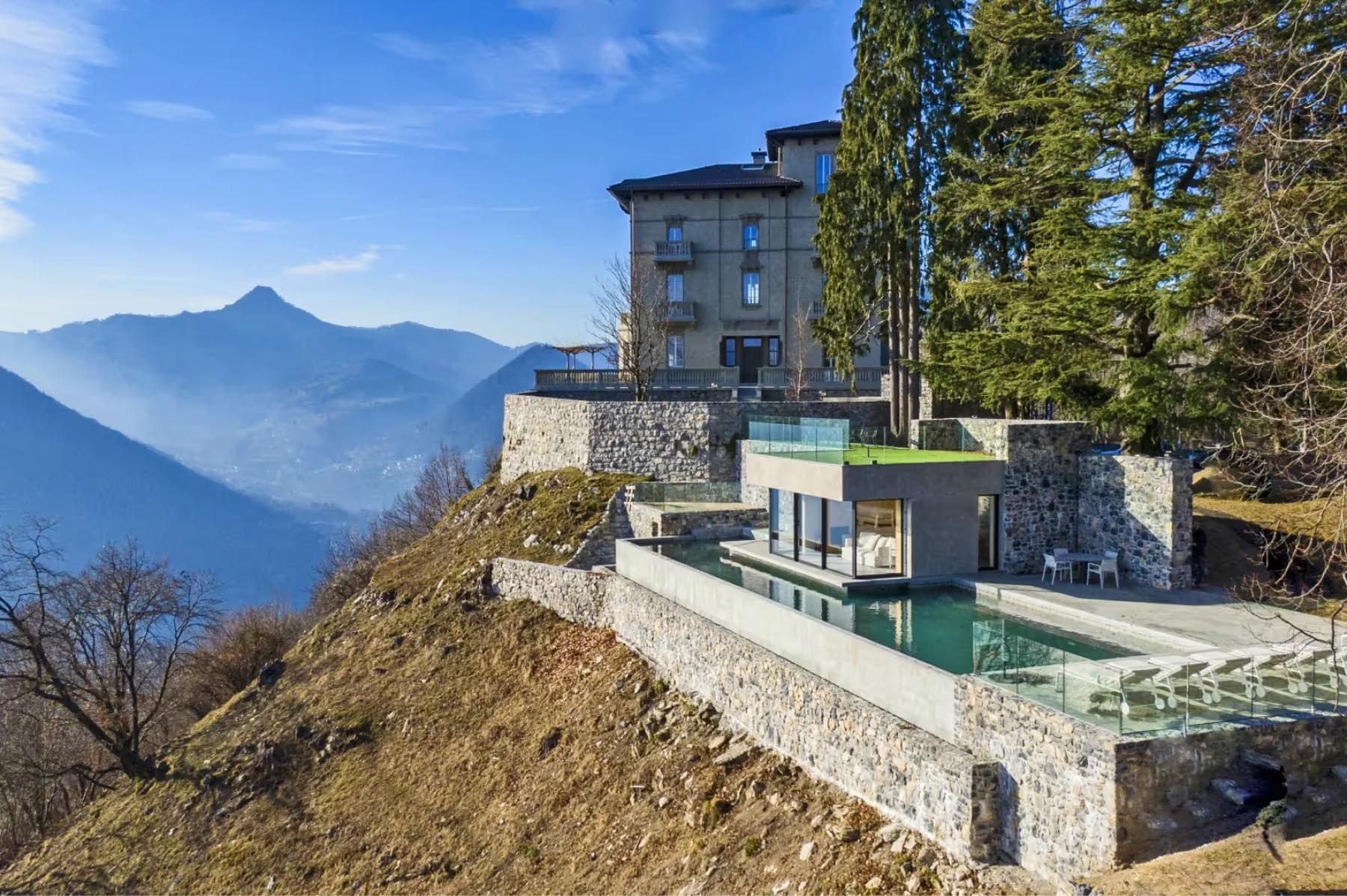 Villa Patrizia: the villa on a hillside with views across the lake to distant mountains