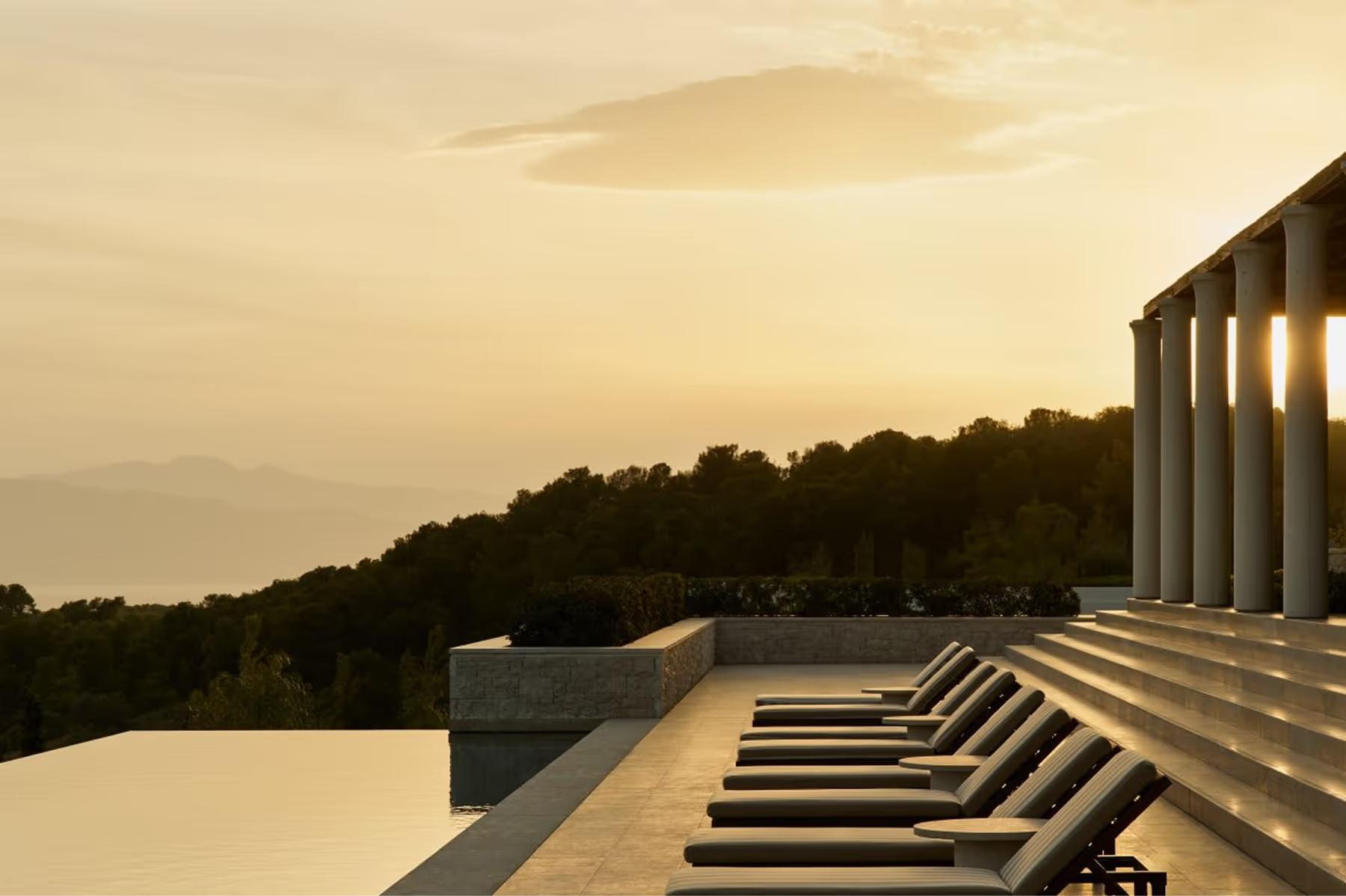 Amanzoe: resort complex with pool reflecting contemporary architecture
