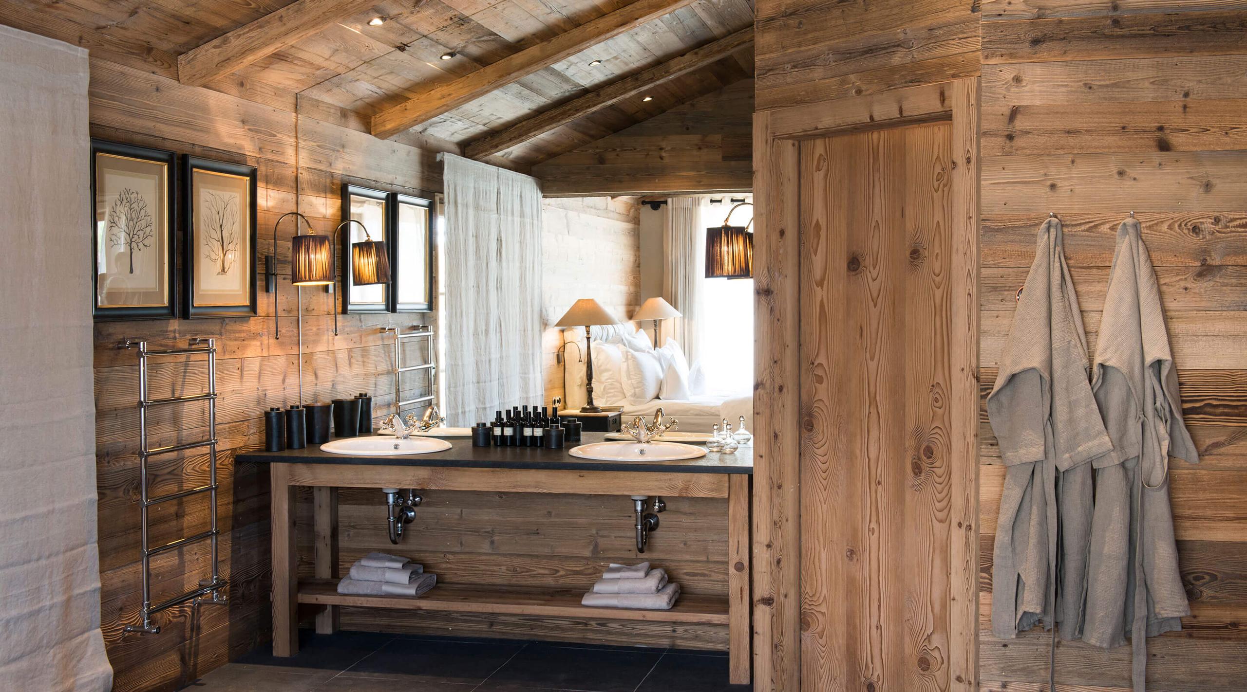 San Luis Retreat: wooden bathroom with a floating sink vanity and natural light