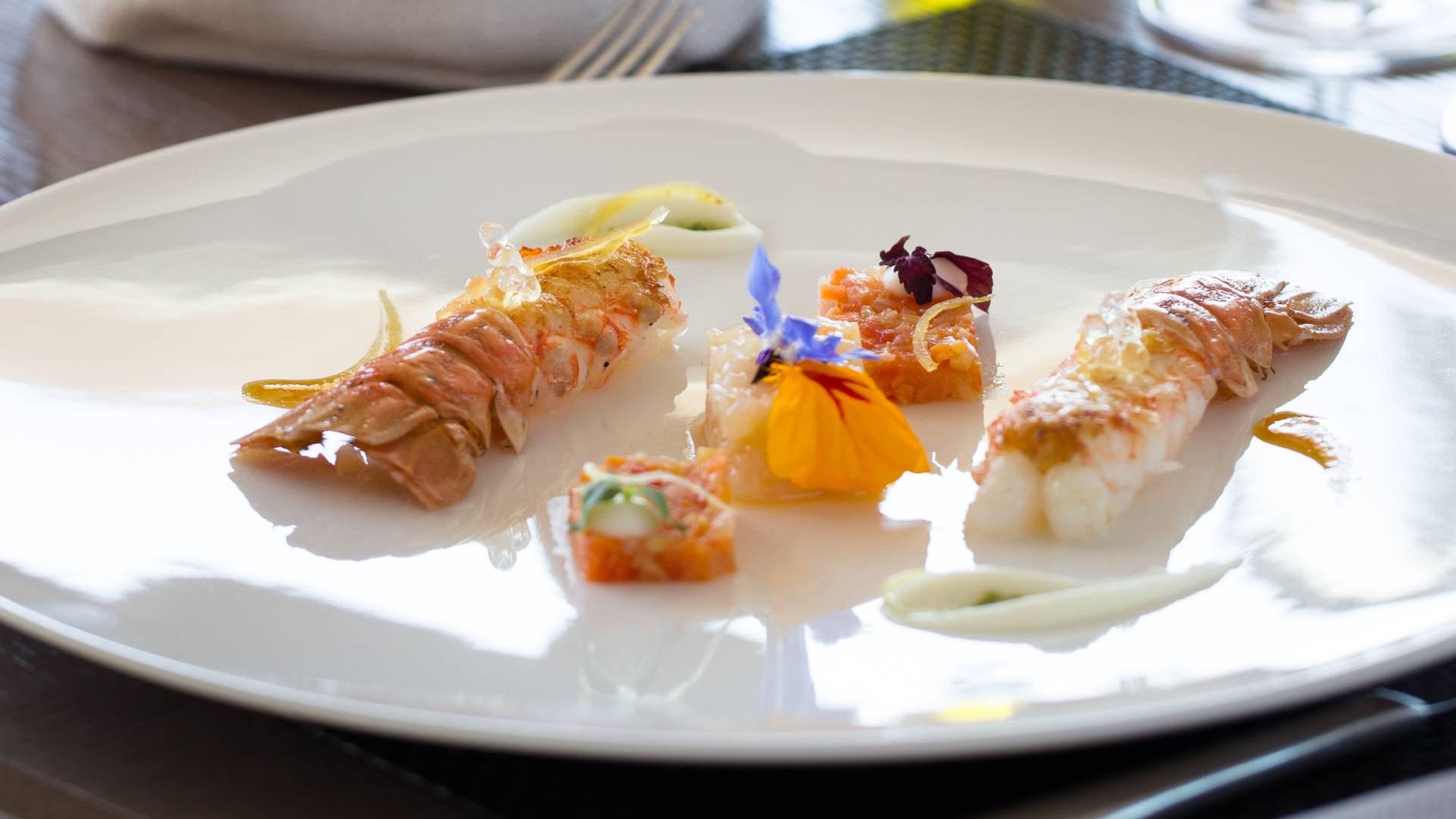 La Réserve Ramatuelle: artistic plated dish with pale protein and colorful garnishes