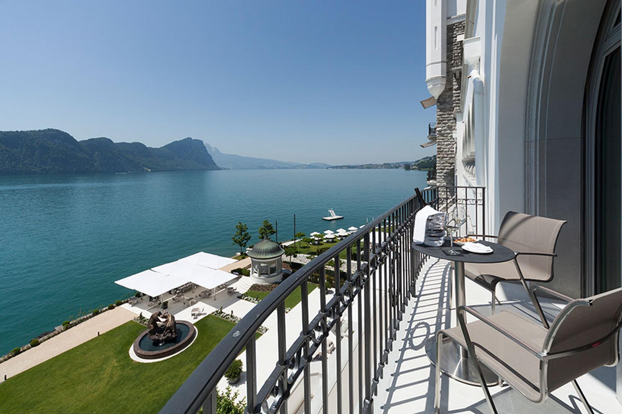 Park Hotel Vitznau: terraced lakeside balcony with dining tables overlooking turquoise water